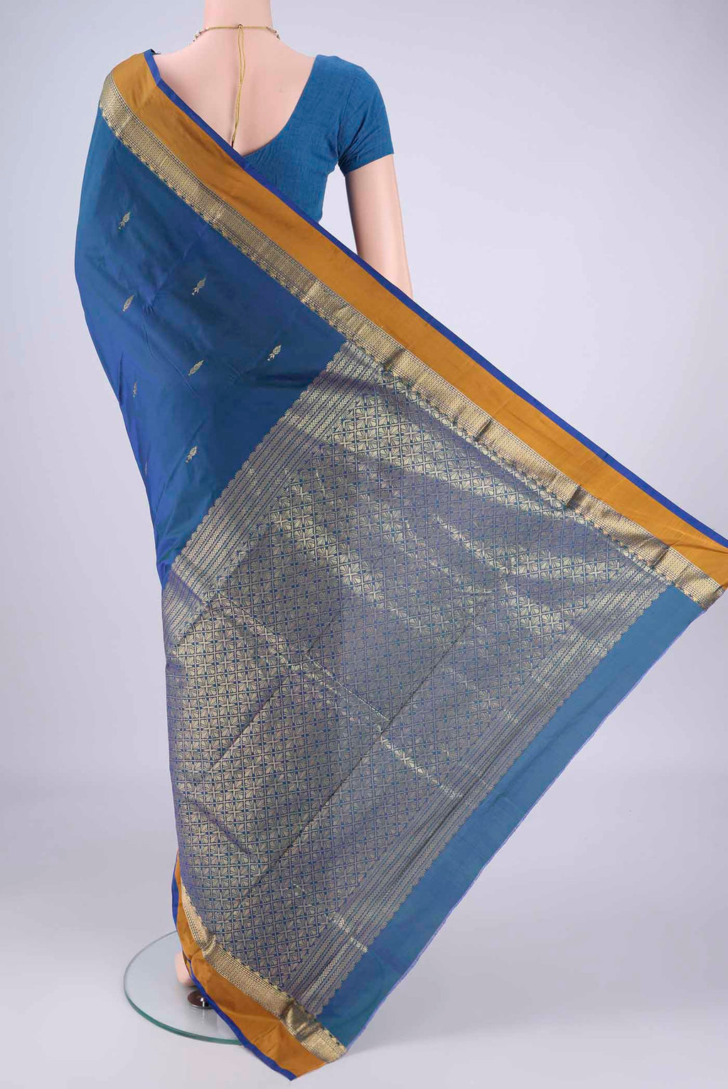Flat view of Peacock Blue Dual Tone Blended Bangalore Silk Saree with Zari Butta on the body and Zari Border. 