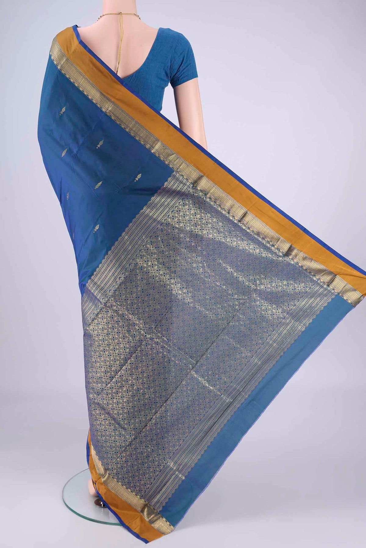 Flat view of Peacock Blue Dual Tone Blended Bangalore Silk Saree with Zari Butta on the body and Zari Border. 