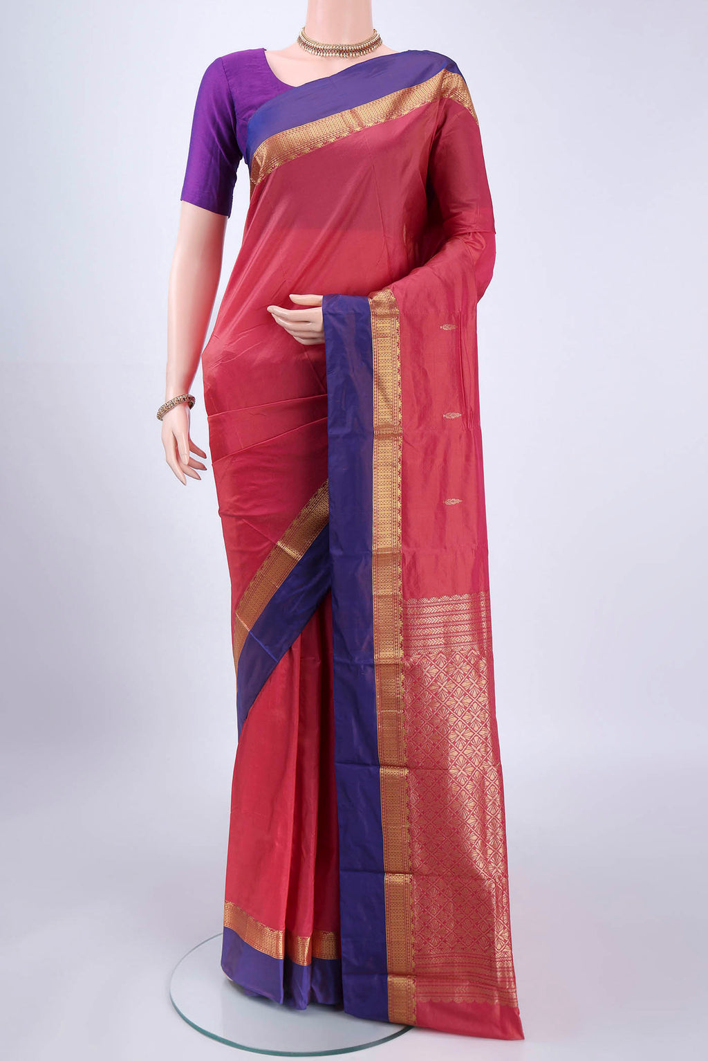 Coral Blended Bangalore Silk Saree with Zari Butta on the body and Zari Border.  displayed on a mannequin