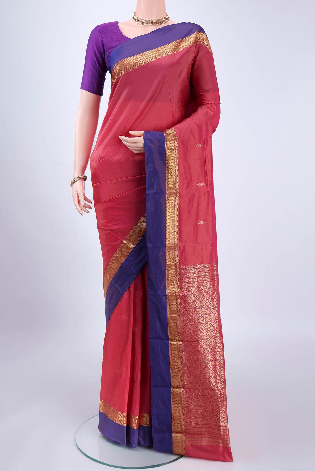 Coral Blended Bangalore Silk Saree with Zari Butta on the body and Zari Border.  displayed on a mannequin
