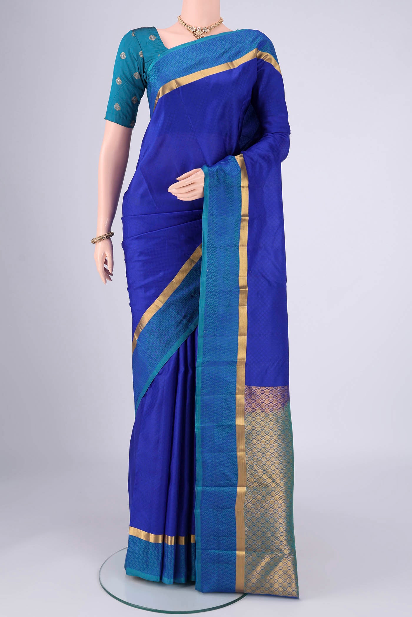 Royal Blue Nangavalli Silk [ Salem ] Saree with Jacquard design on the body and Plain Border.  displayed on a mannequin