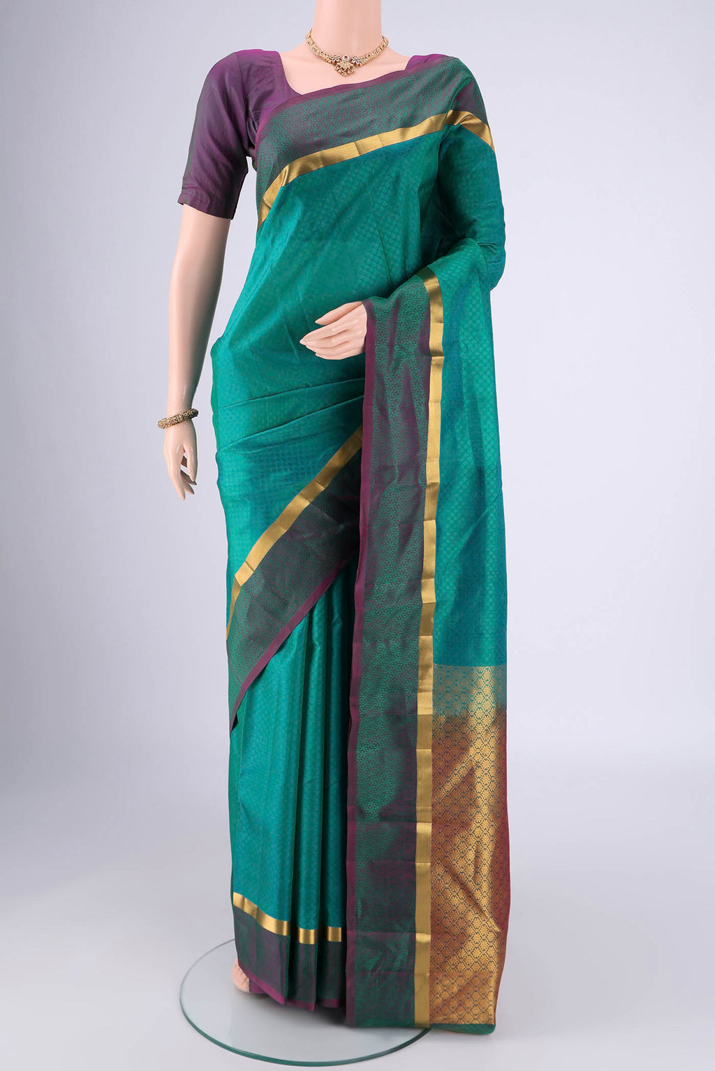 Sea Green Nangavalli Silk [ Salem ] Saree with Jacquard design on the body and Plain Border.  displayed on a mannequin