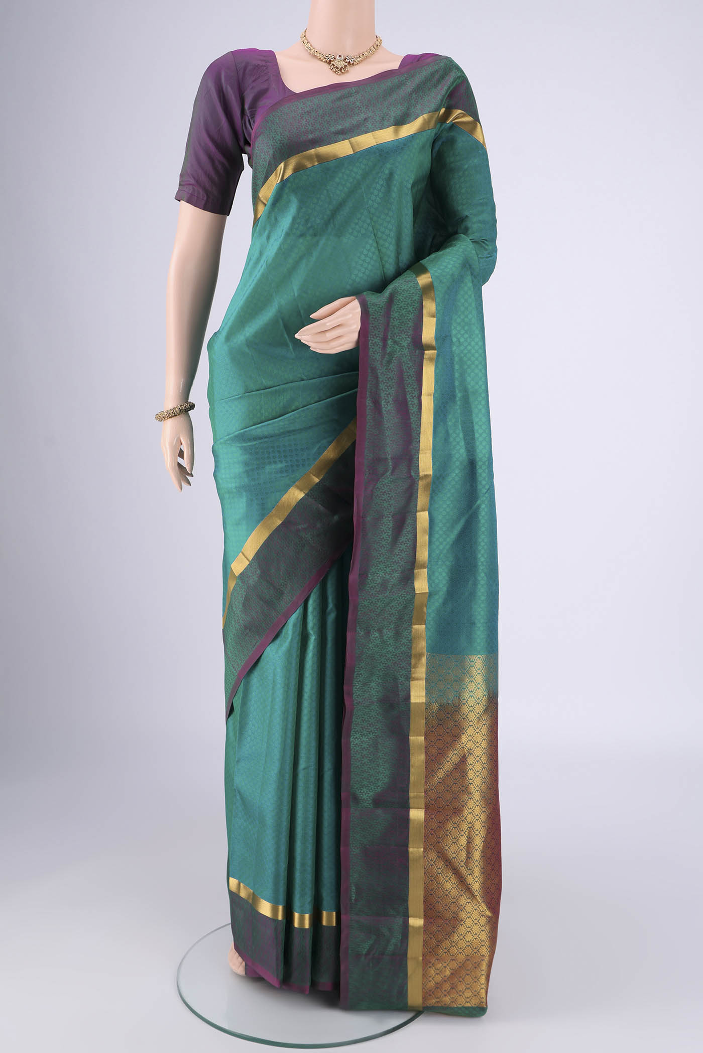 Sea Green Nangavalli Silk [ Salem ] Saree with Jacquard design on the body and Plain Border.  displayed on a mannequin