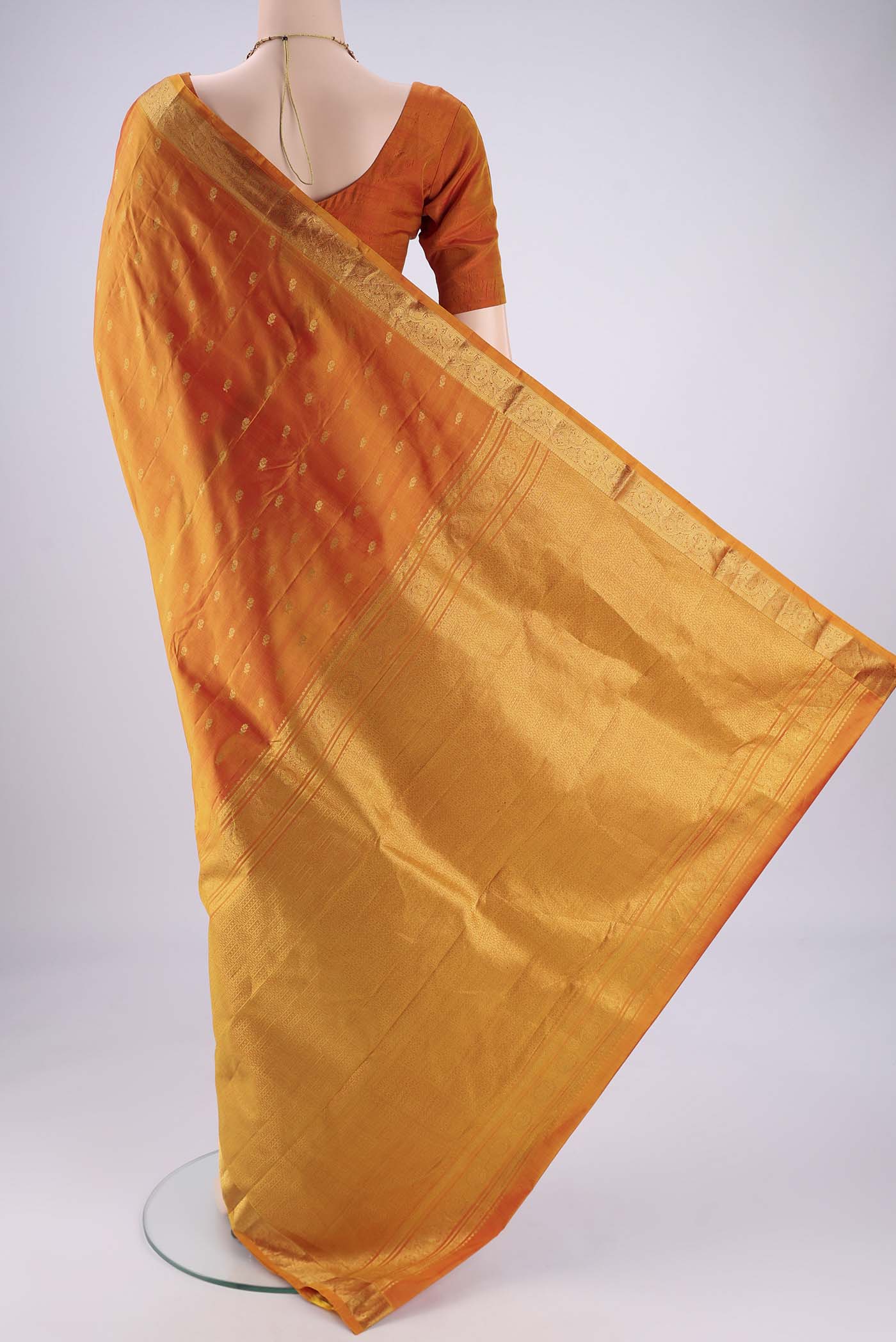 Flat view of Yellow Nangavalli Silk [ Salem ] Saree with Zari Butta on the body and Zari Border. 