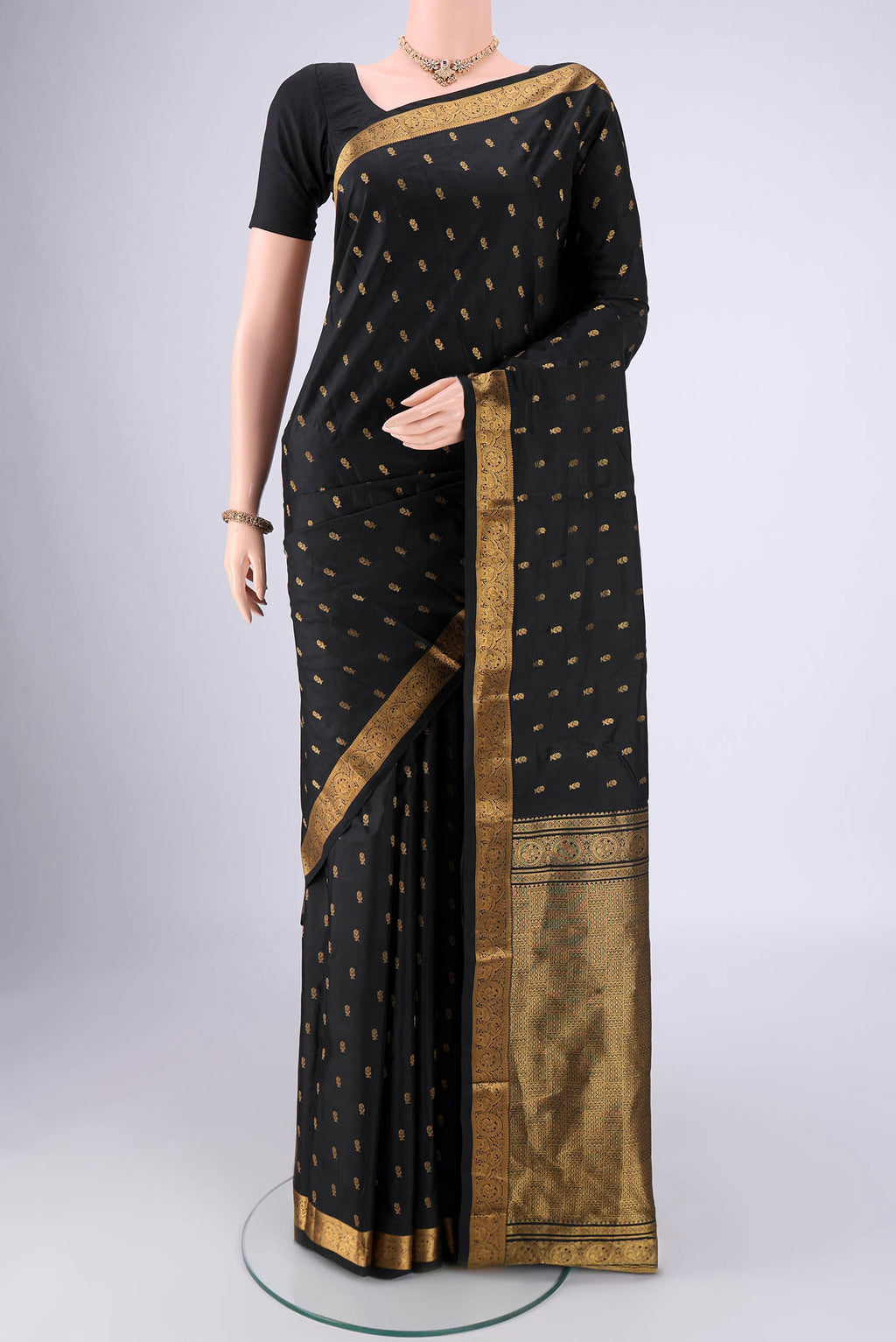 Black Nangavalli Silk [ Salem ] Saree with Zari Butta on the body and Zari Border.  displayed on a mannequin