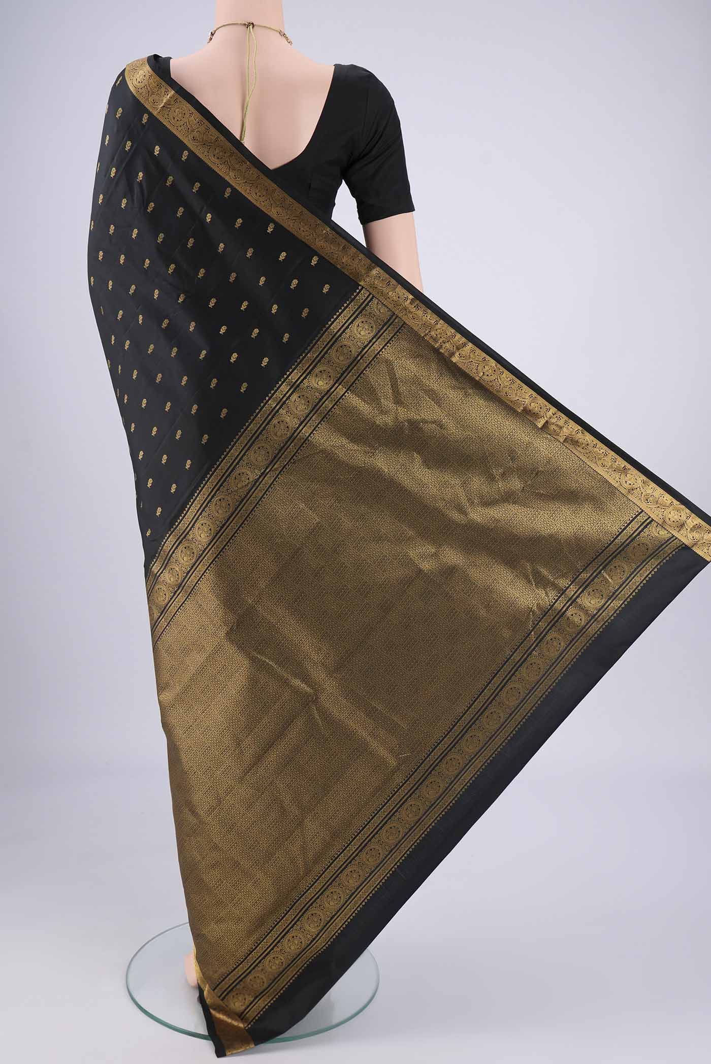 Flat view of Black Nangavalli Silk [ Salem ] Saree with Zari Butta on the body and Zari Border. 
