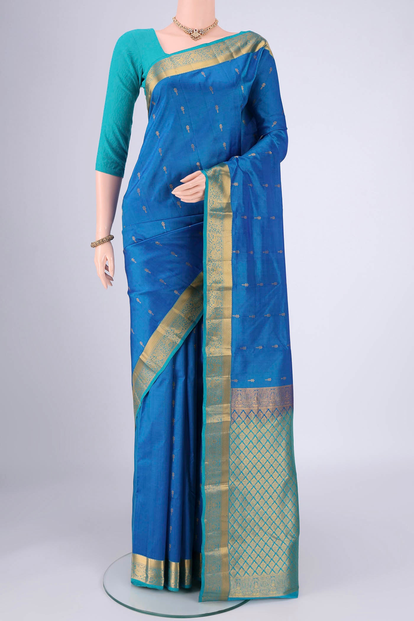 Blue Nangavalli Silk [ Salem ] Saree with Zari Butta on the body and Zari Border.  displayed on a mannequin