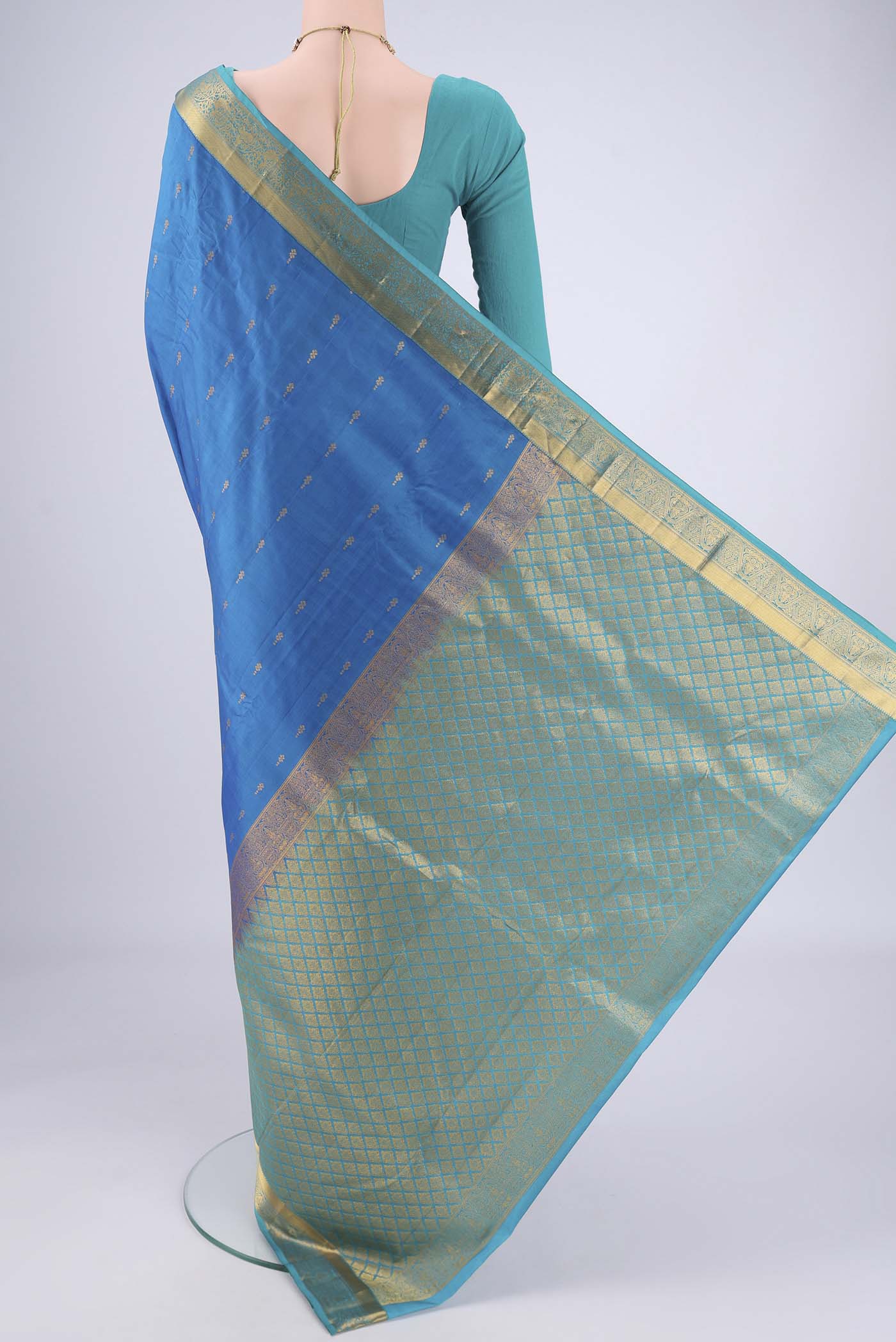 Flat view of Blue Nangavalli Silk [ Salem ] Saree with Zari Butta on the body and Zari Border. 