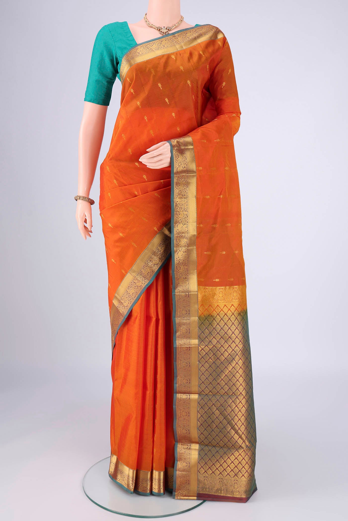 Yellow Nangavalli Silk [ Salem ] Saree with Zari Butta on the body and Zari Border.  displayed on a mannequin