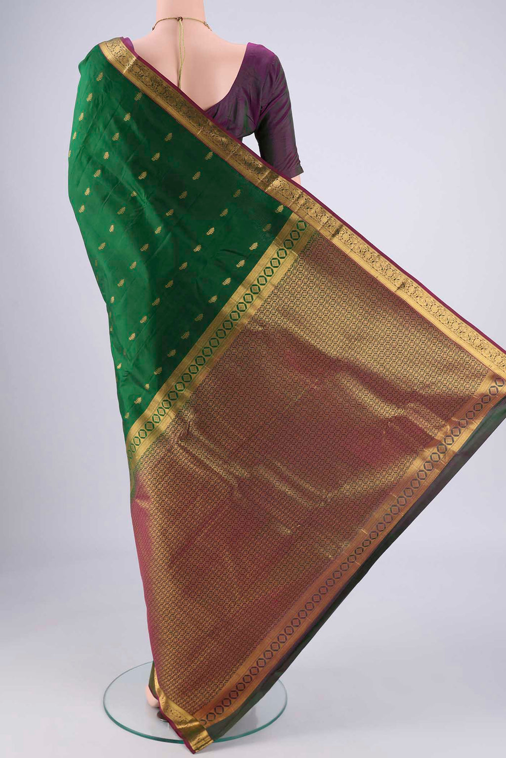 Flat view of Bottle Green Nangavalli Silk [ Salem ] Saree with Zari Butta on the body and Zari Border. 