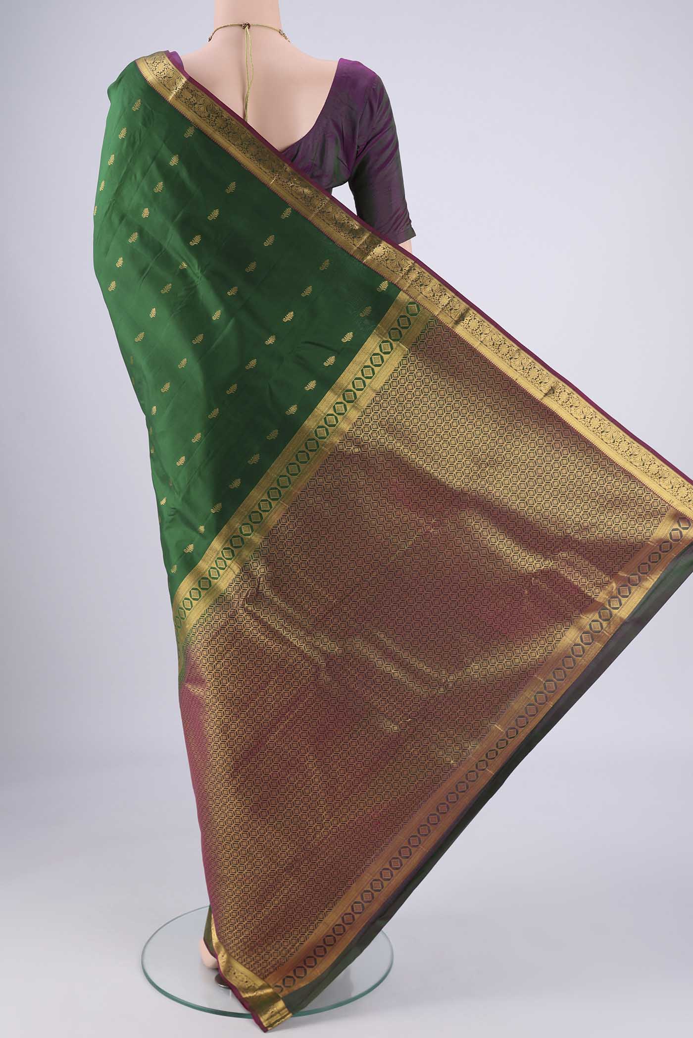Flat view of Bottle Green Nangavalli Silk [ Salem ] Saree with Zari Butta on the body and Zari Border. 