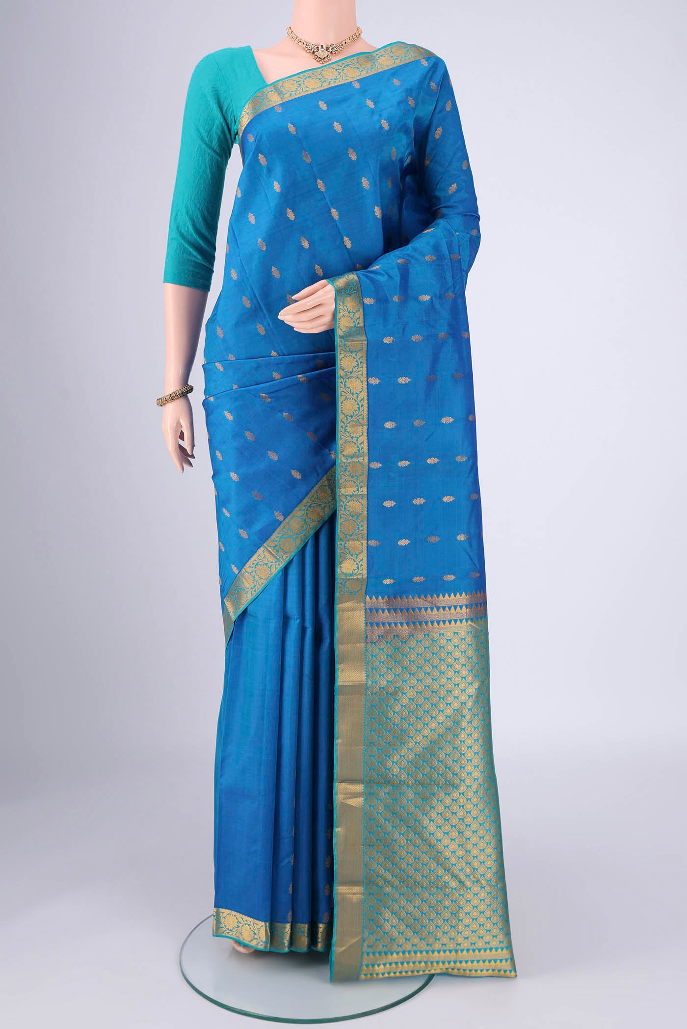 Blue Nangavalli Silk [ Salem ] Saree with Zari Butta on the body and Zari Border.  displayed on a mannequin