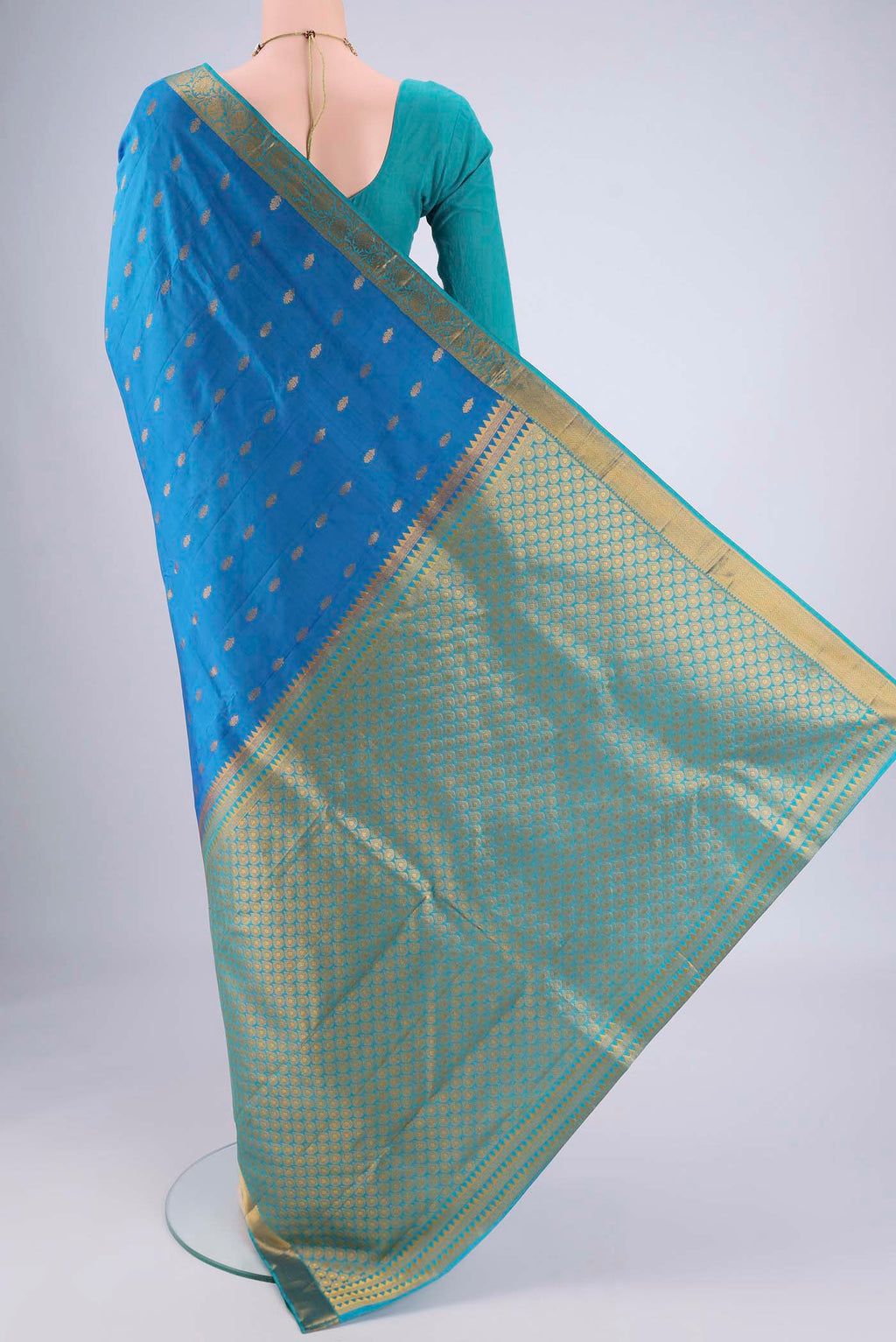 Flat view of Blue Nangavalli Silk [ Salem ] Saree with Zari Butta on the body and Zari Border. 