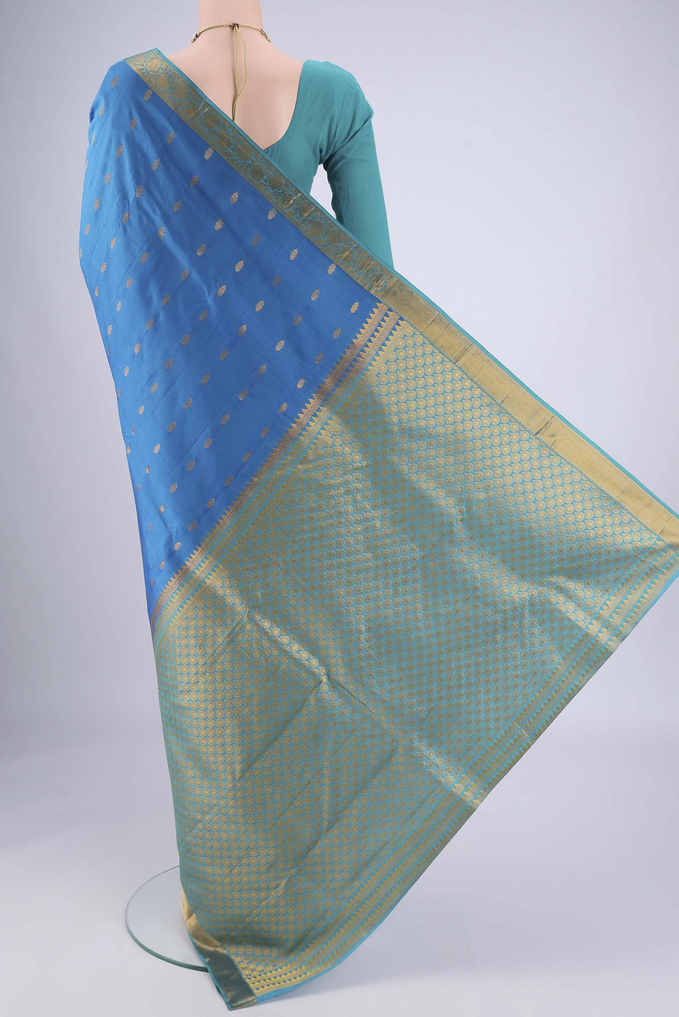 Flat view of Blue Nangavalli Silk [ Salem ] Saree with Zari Butta on the body and Zari Border. 