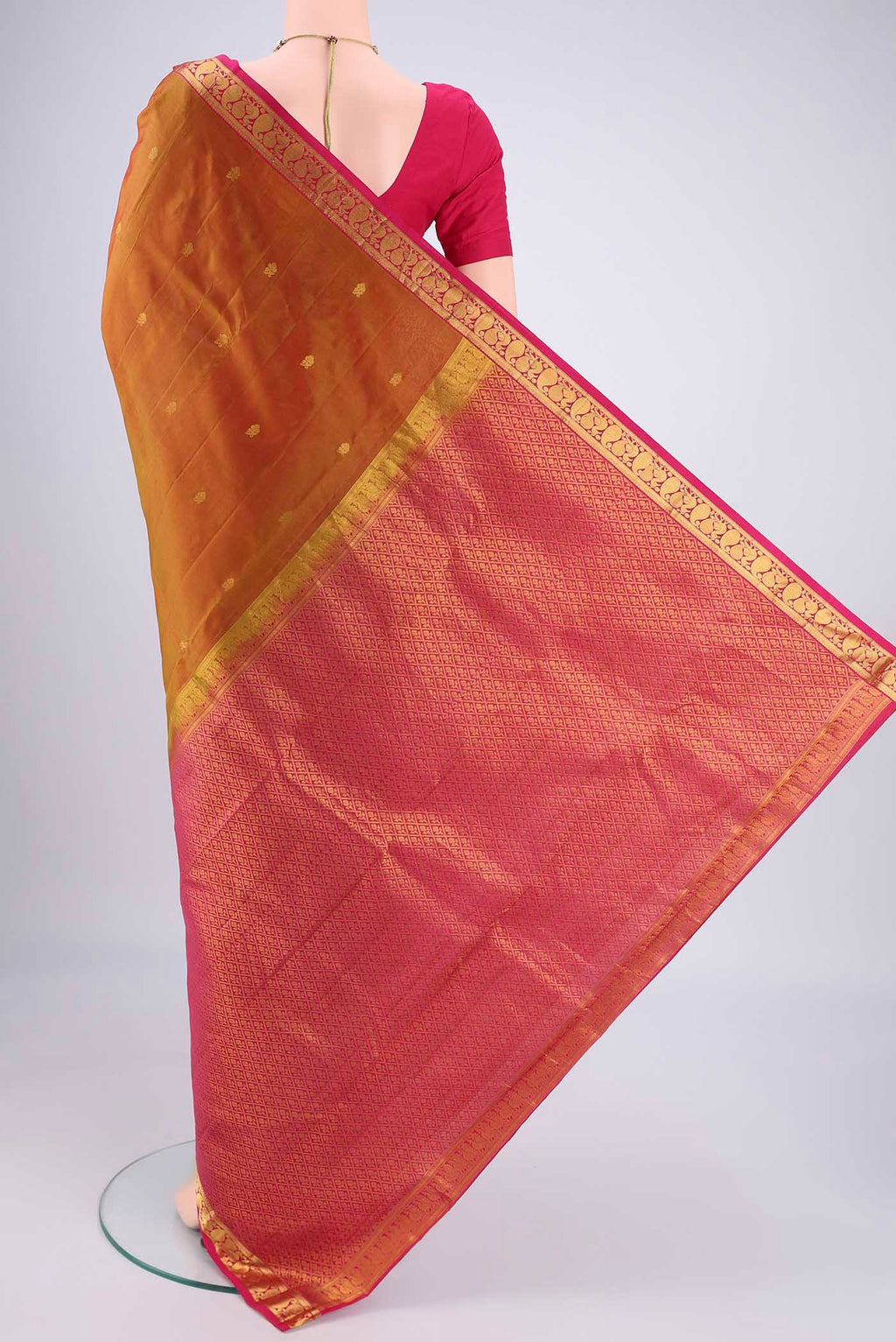 Flat view of Mehandi Green Dual Tone Kanjivaram Silk Saree with Zari Butta on the body and Zari Border. 