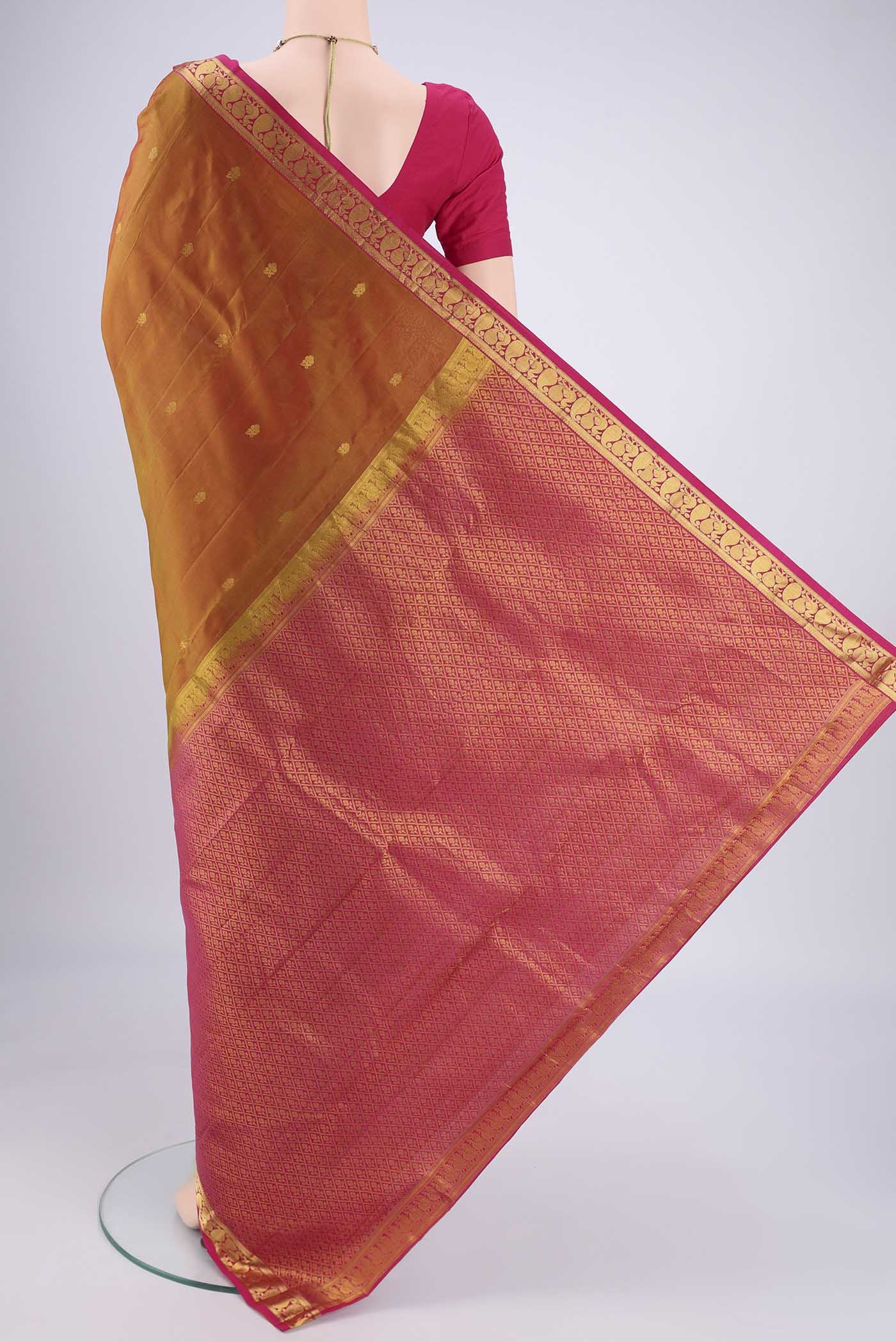 Flat view of Mehandi Green Dual Tone Kanjivaram Silk Saree with Zari Butta on the body and Zari Border. 