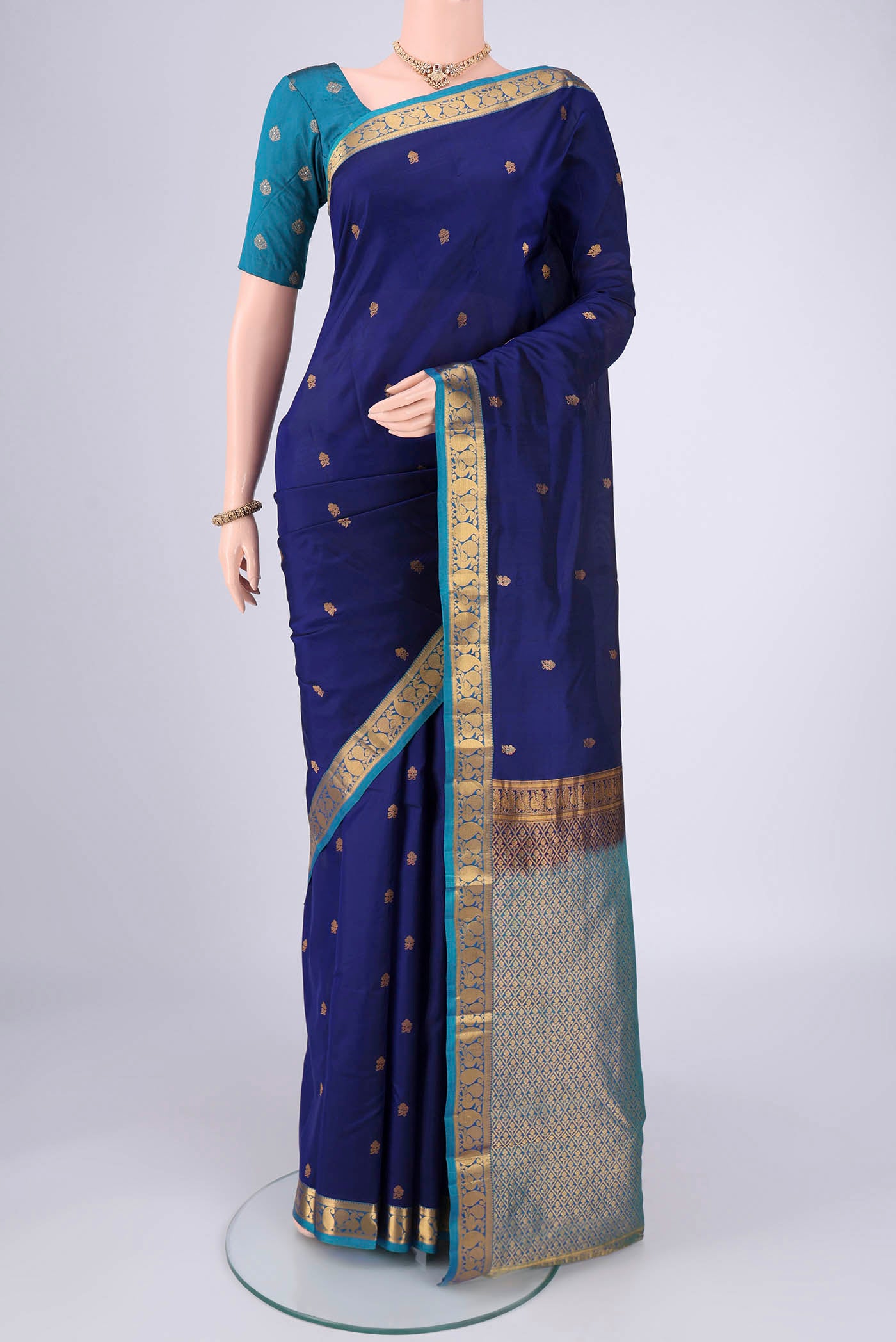 Navy Blue Nangavalli Silk [ Salem ] Saree with Zari Butta on the body and Zari Border.  displayed on a mannequin