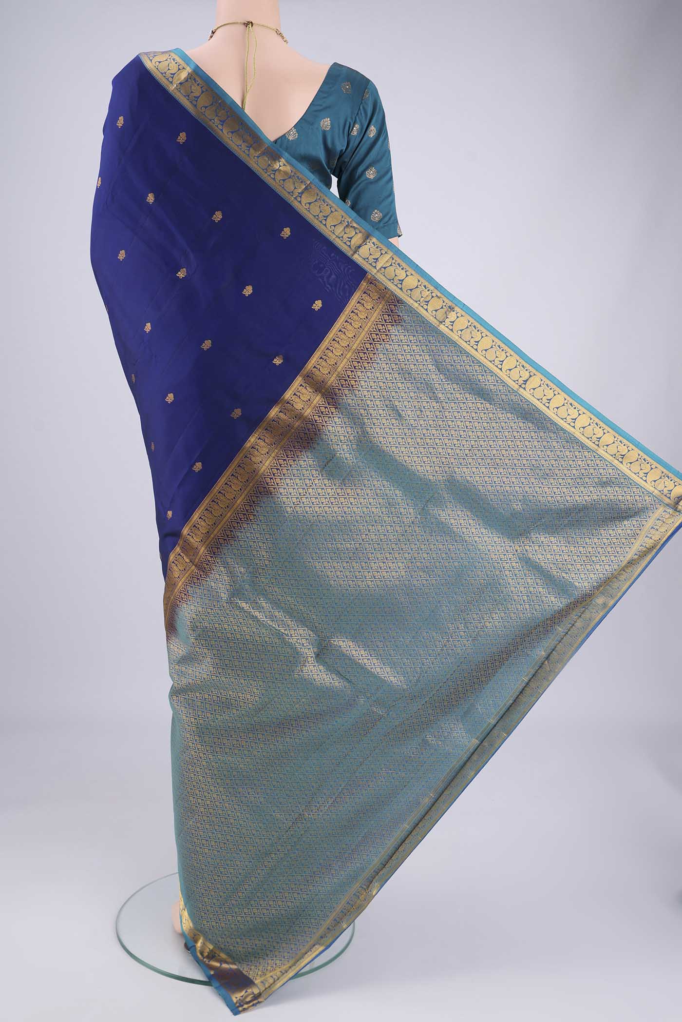 Flat view of Navy Blue Nangavalli Silk [ Salem ] Saree with Zari Butta on the body and Zari Border. 
