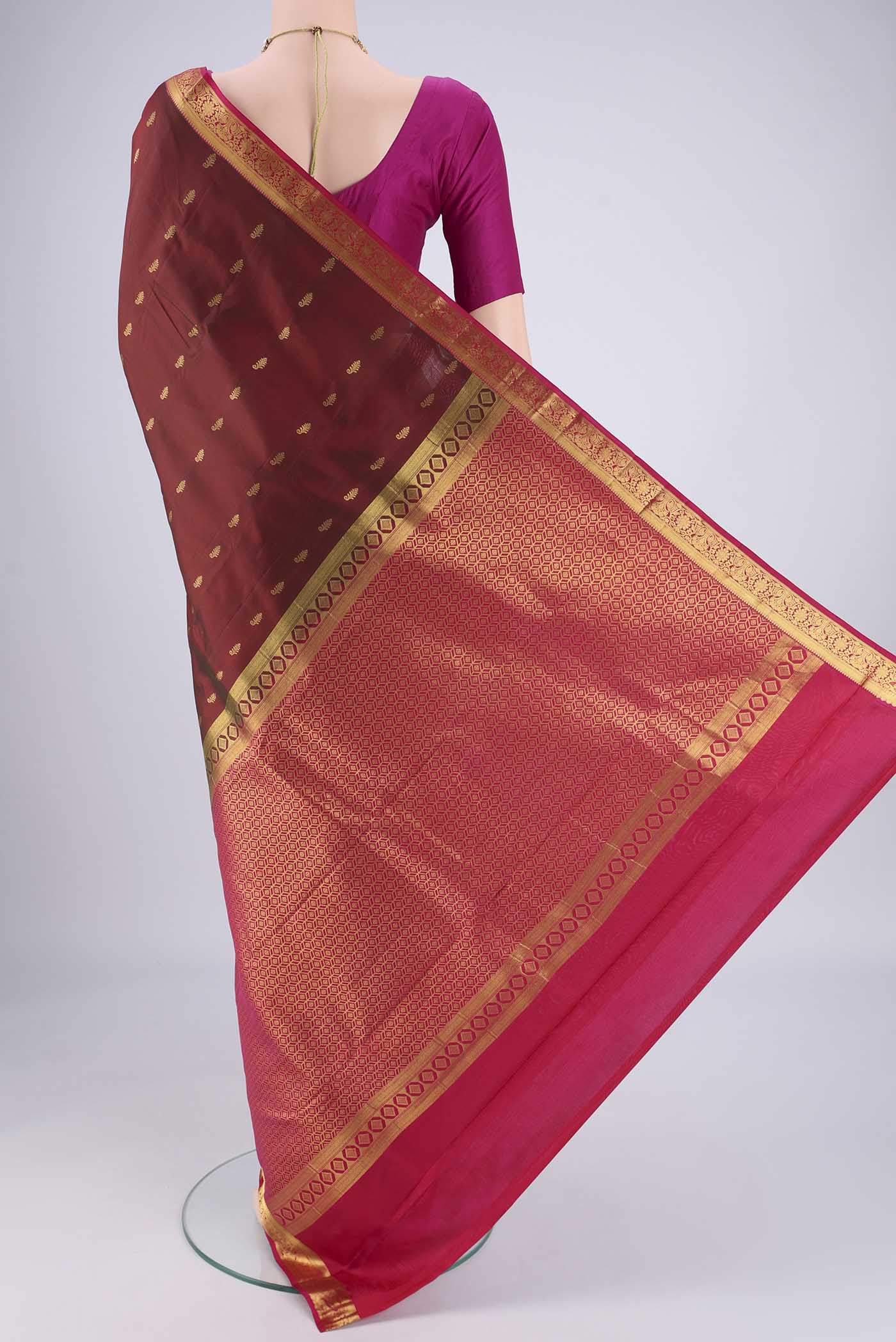 Flat view of Maroon Nangavalli Silk [ Salem ] Saree with Zari Butta on the body and Zari Border. 