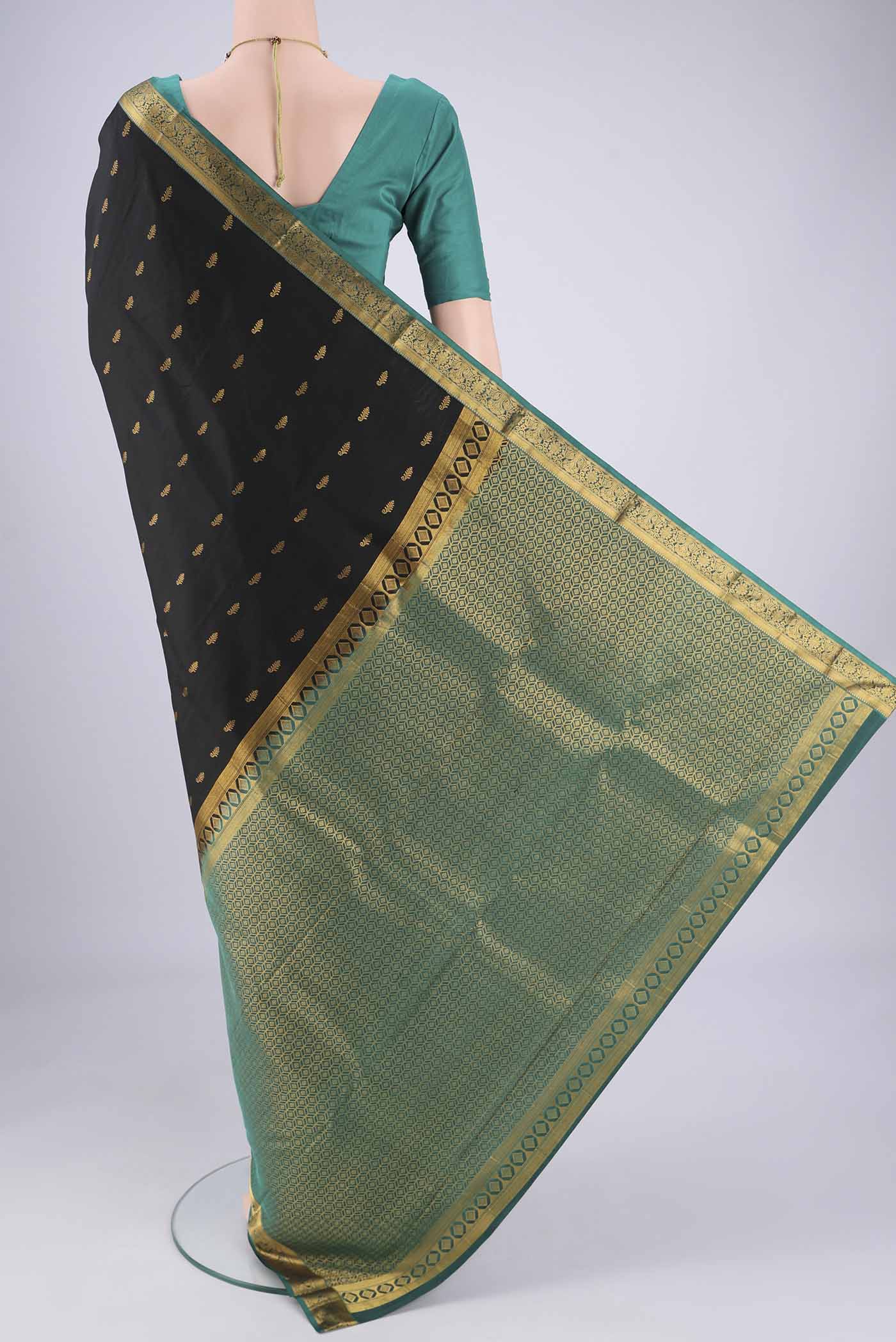 Flat view of Black Nangavalli Silk [ Salem ] Saree with Zari Butta on the body and Zari Border. 