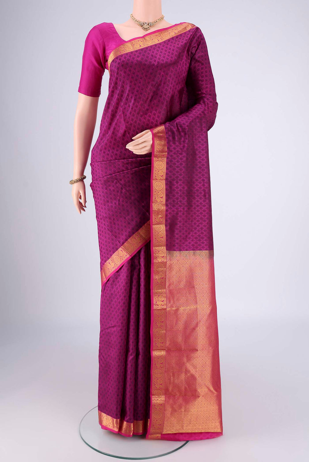 Magenta Nangavalli Silk [ Salem ] Saree with Jacquard design on the body and Zari Border.  displayed on a mannequin