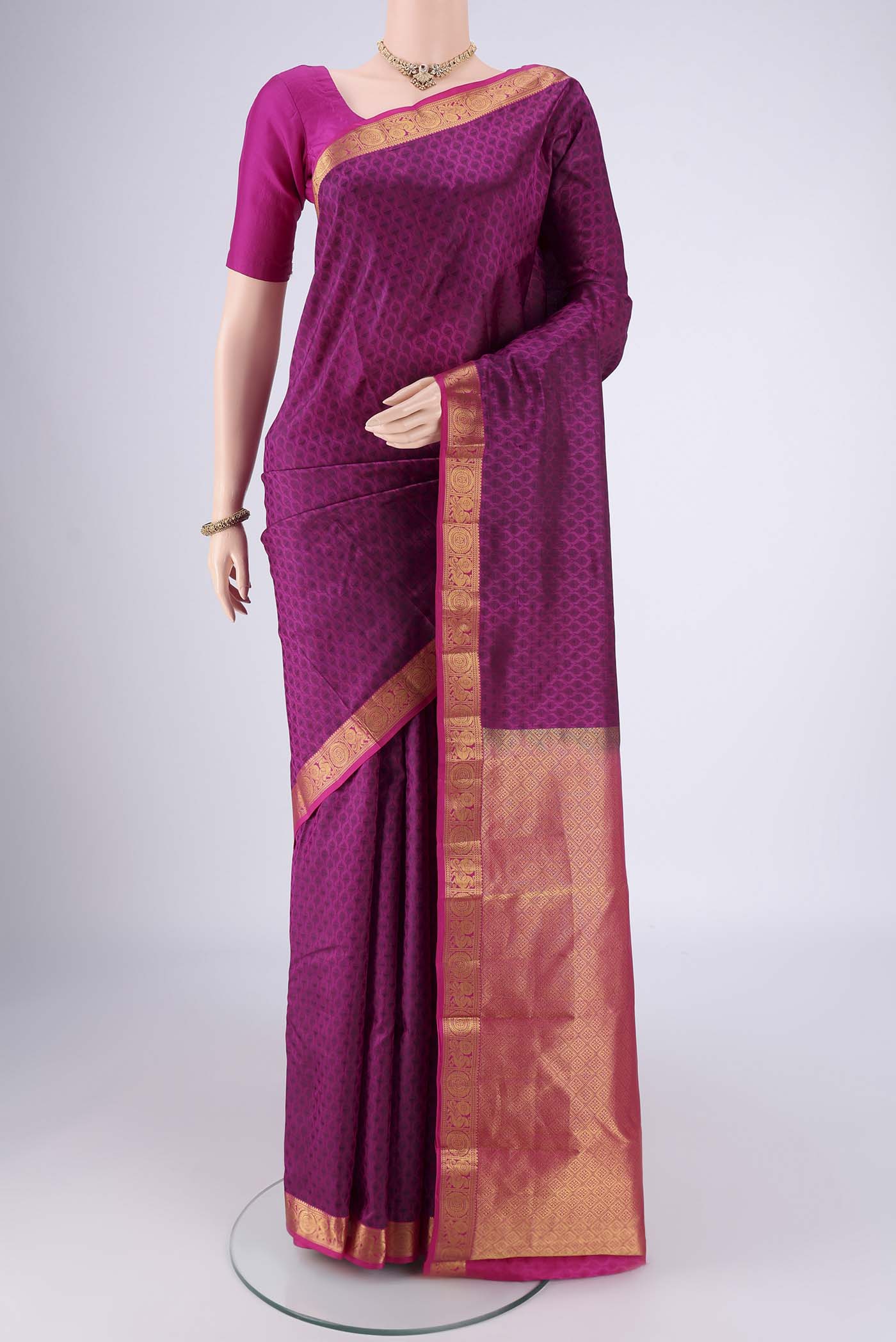 Magenta Nangavalli Silk [ Salem ] Saree with Jacquard design on the body and Zari Border.  displayed on a mannequin