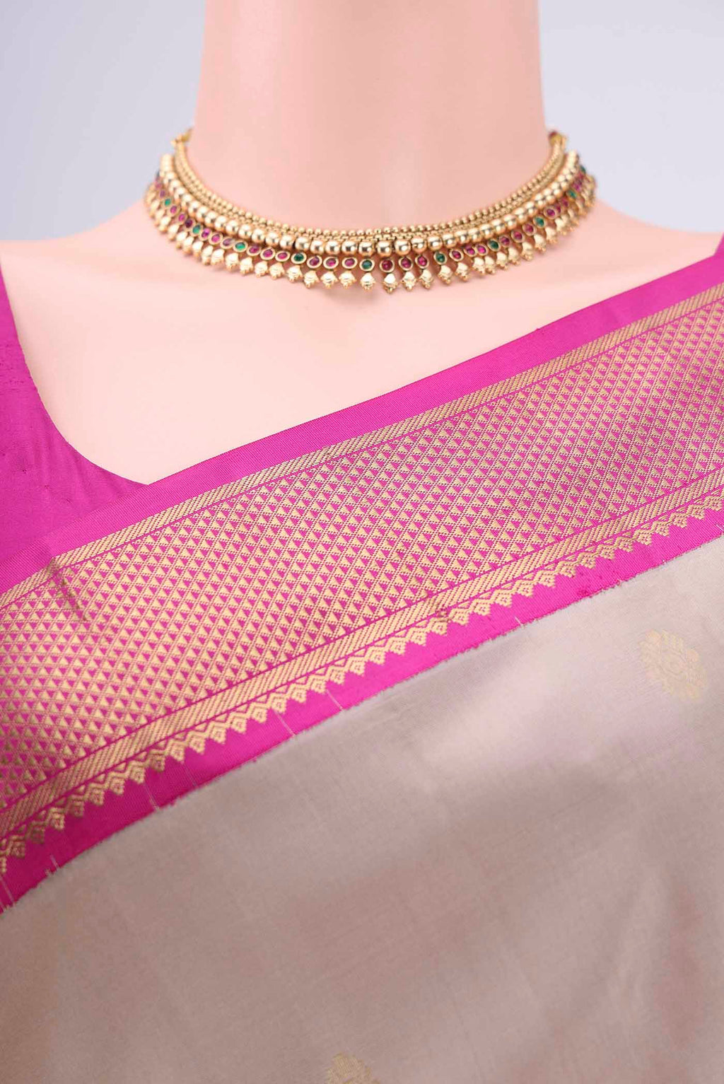 Border image of Beige Kanchipuram Silk Saree with Zari Butta on the body and Zari Border. 
