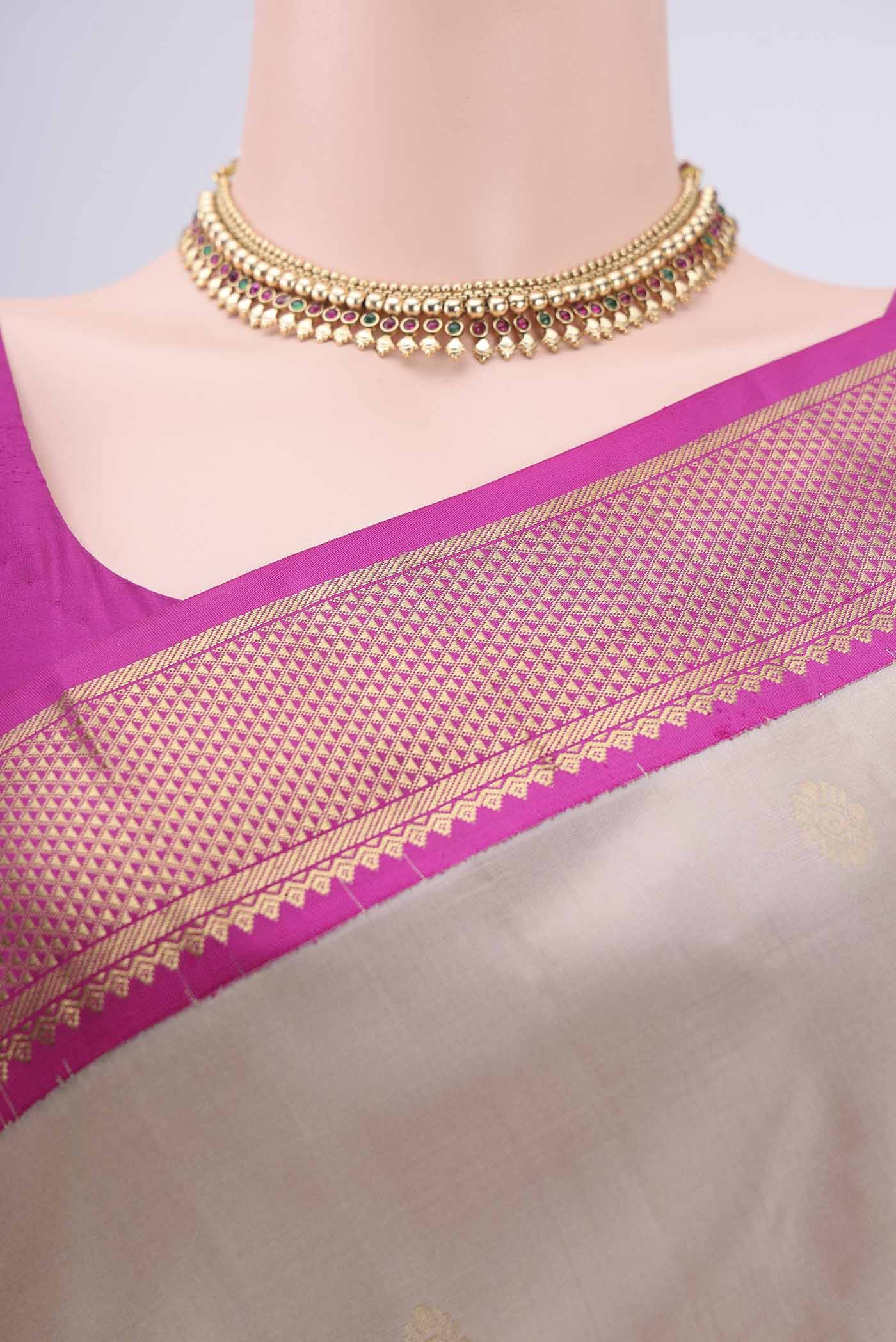 Border image of Beige Kanchipuram Silk Saree with Zari Butta on the body and Zari Border. 