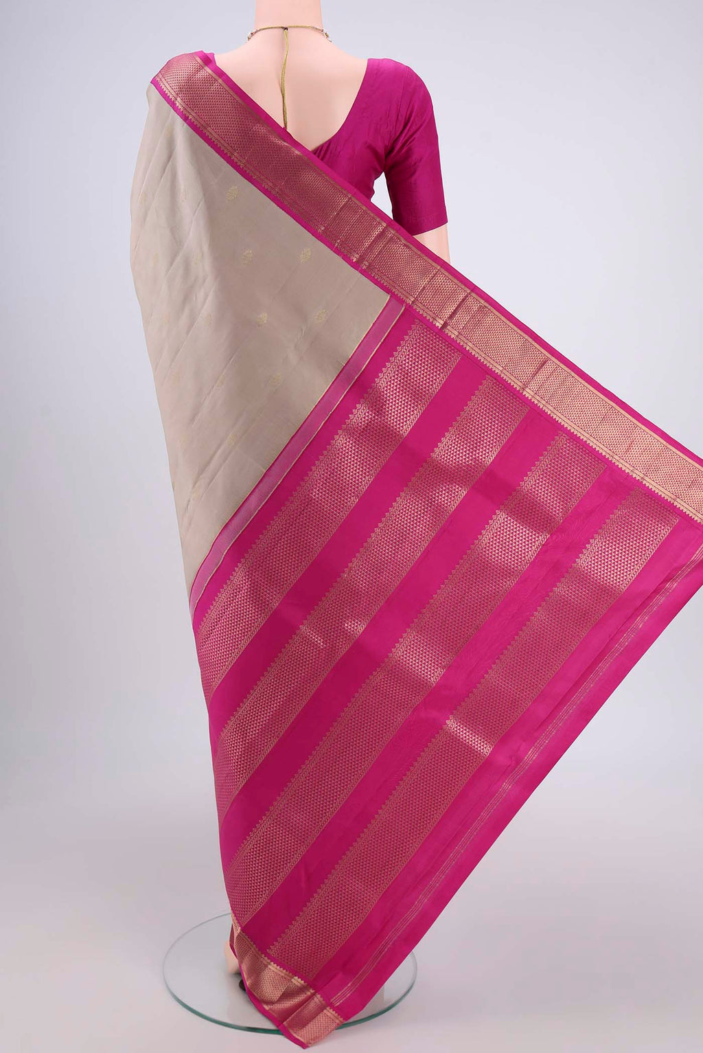 Flat view of Beige Kanchipuram Silk Saree with Zari Butta on the body and Zari Border. 