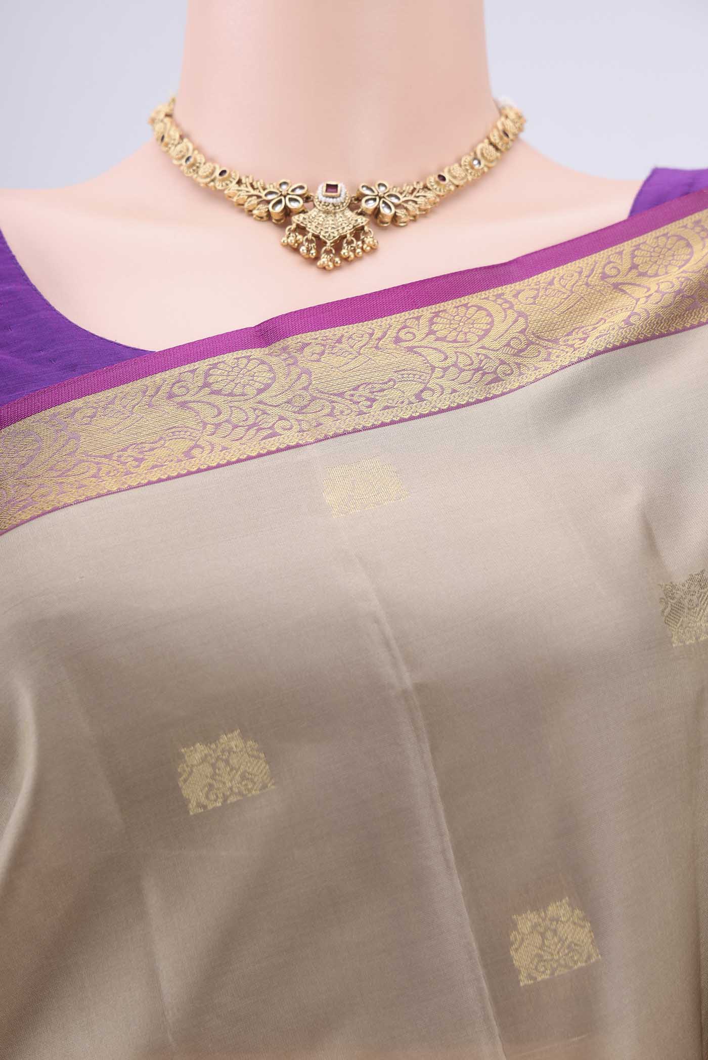 Border image of Beige Dual Tone Kanjivaram Silk Saree with Zari Butta on the body and Zari Border. 