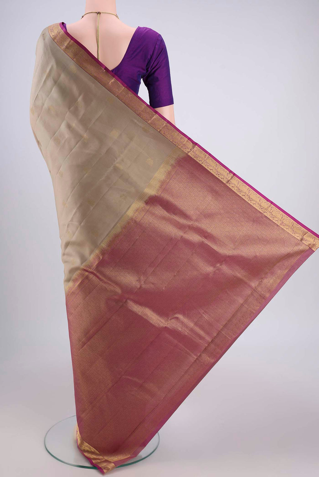 Flat view of Beige Dual Tone Kanjivaram Silk Saree with Zari Butta on the body and Zari Border. 