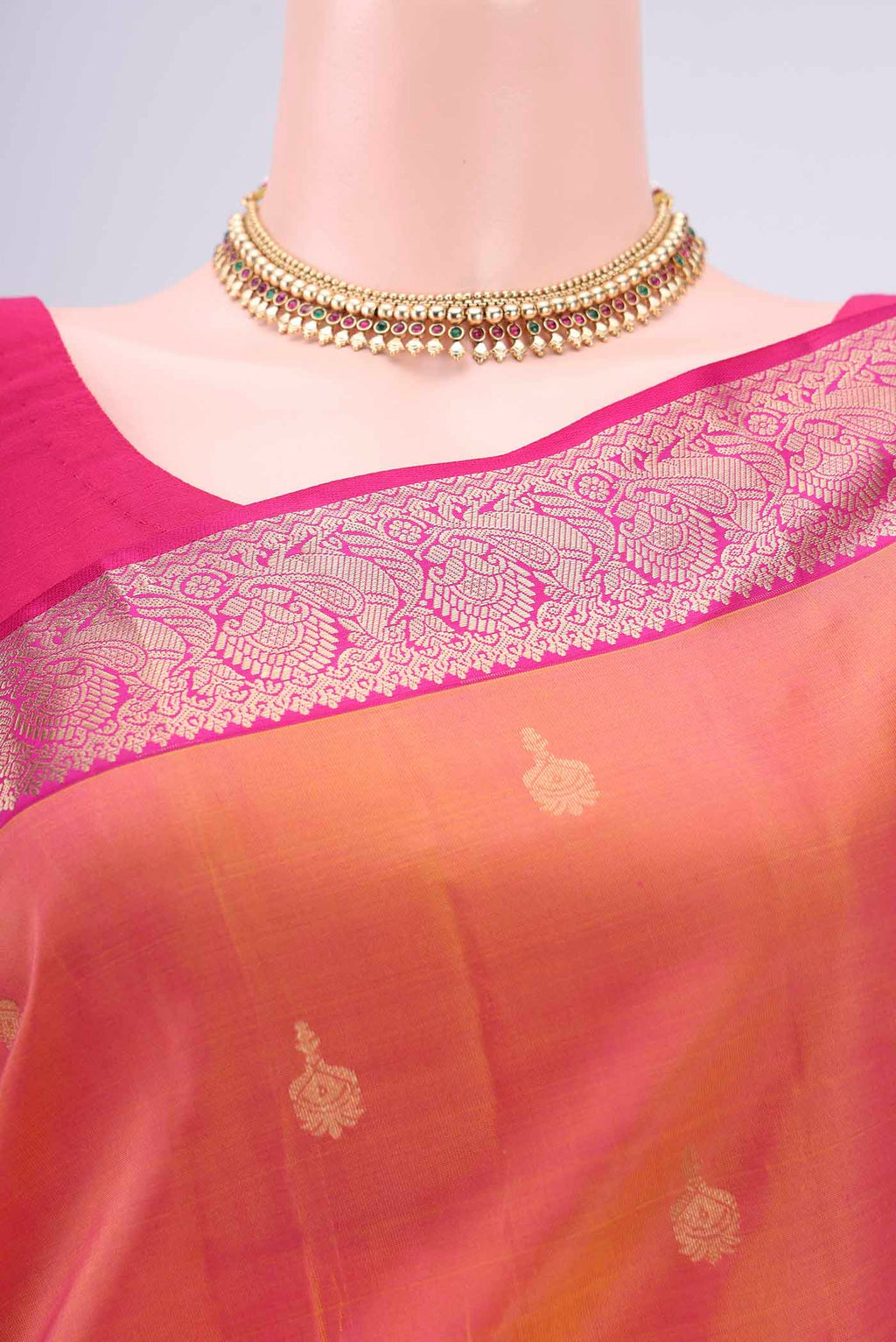 Border image of Brick Orange Kanjivaram Silk Saree with Zari Butta on the body and Zari Border. 