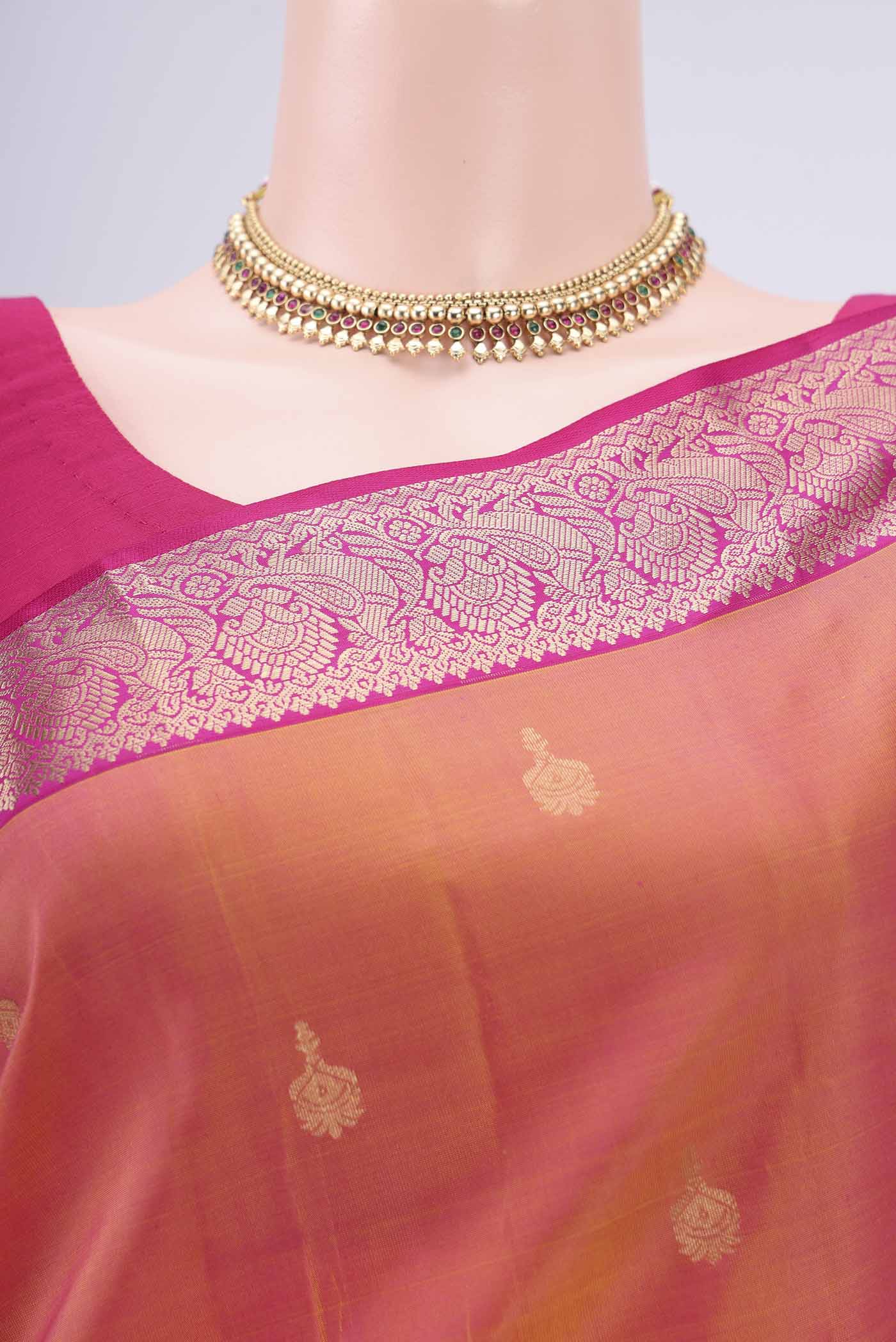 Border image of Brick Orange Kanjivaram Silk Saree with Zari Butta on the body and Zari Border. 