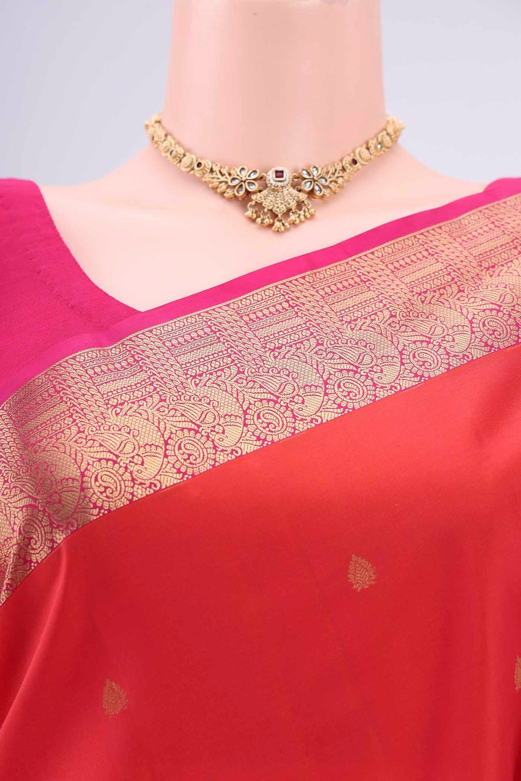 Border image of Orange Kanchipuram Silk Saree with Zari Butta on the body and Zari Border. 