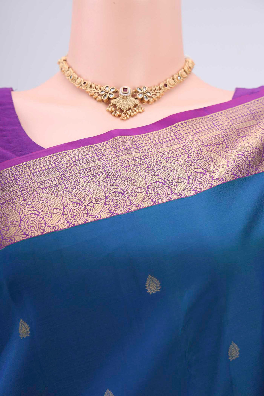 Border image of Peacock Blue Dual Tone Kanchipuram Silk Saree with Zari Butta on the body and Zari Border. 