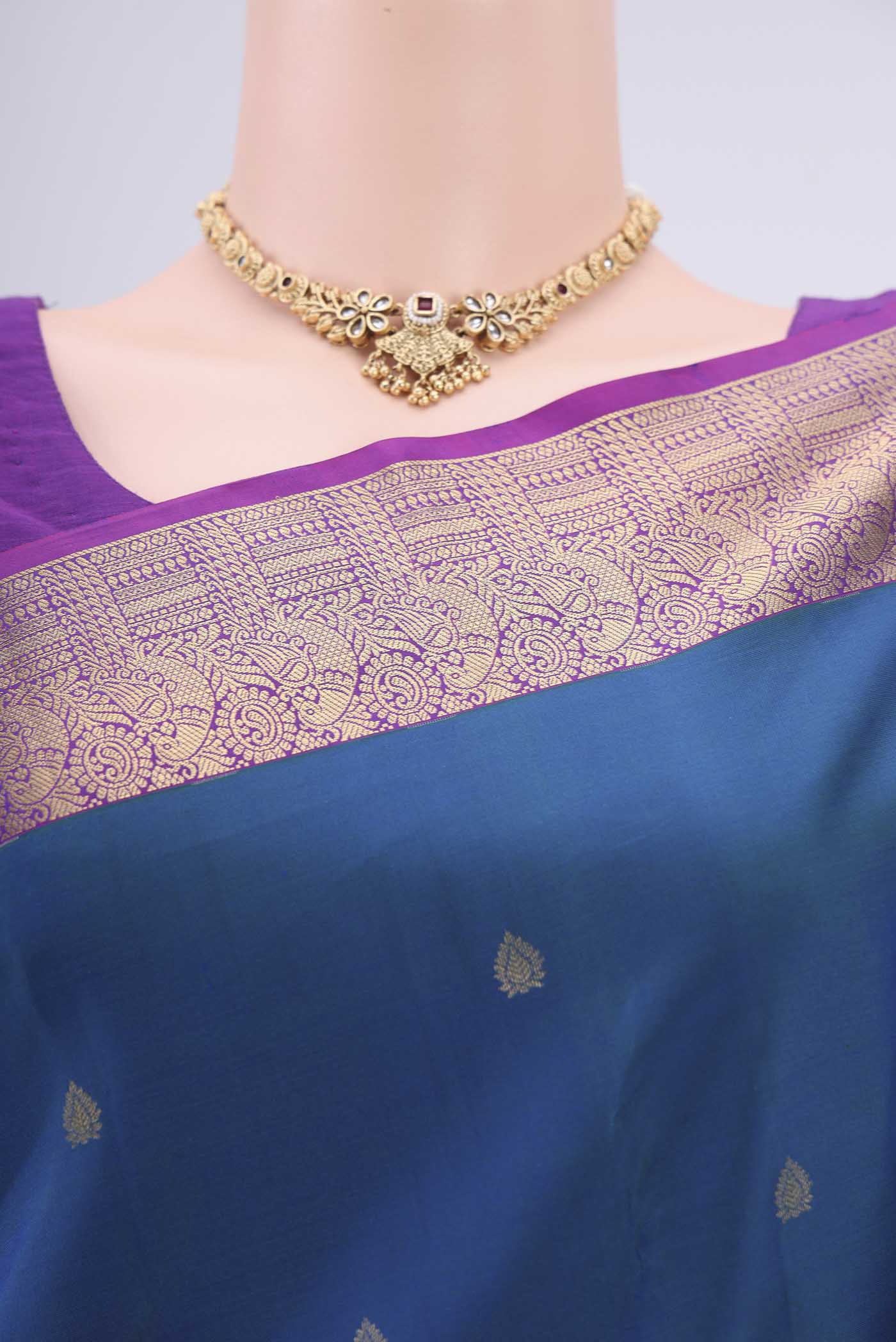 Border image of Peacock Blue Dual Tone Kanchipuram Silk Saree with Zari Butta on the body and Zari Border. 
