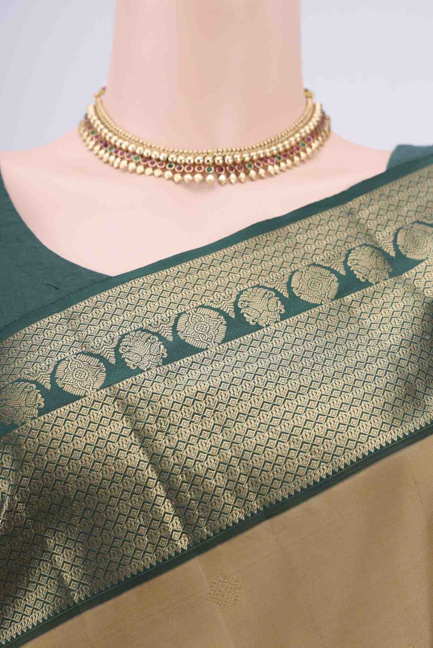 Border image of Dark Beige Kanchipuram Silk Saree with Zari Butta on the body and Zari Border. 