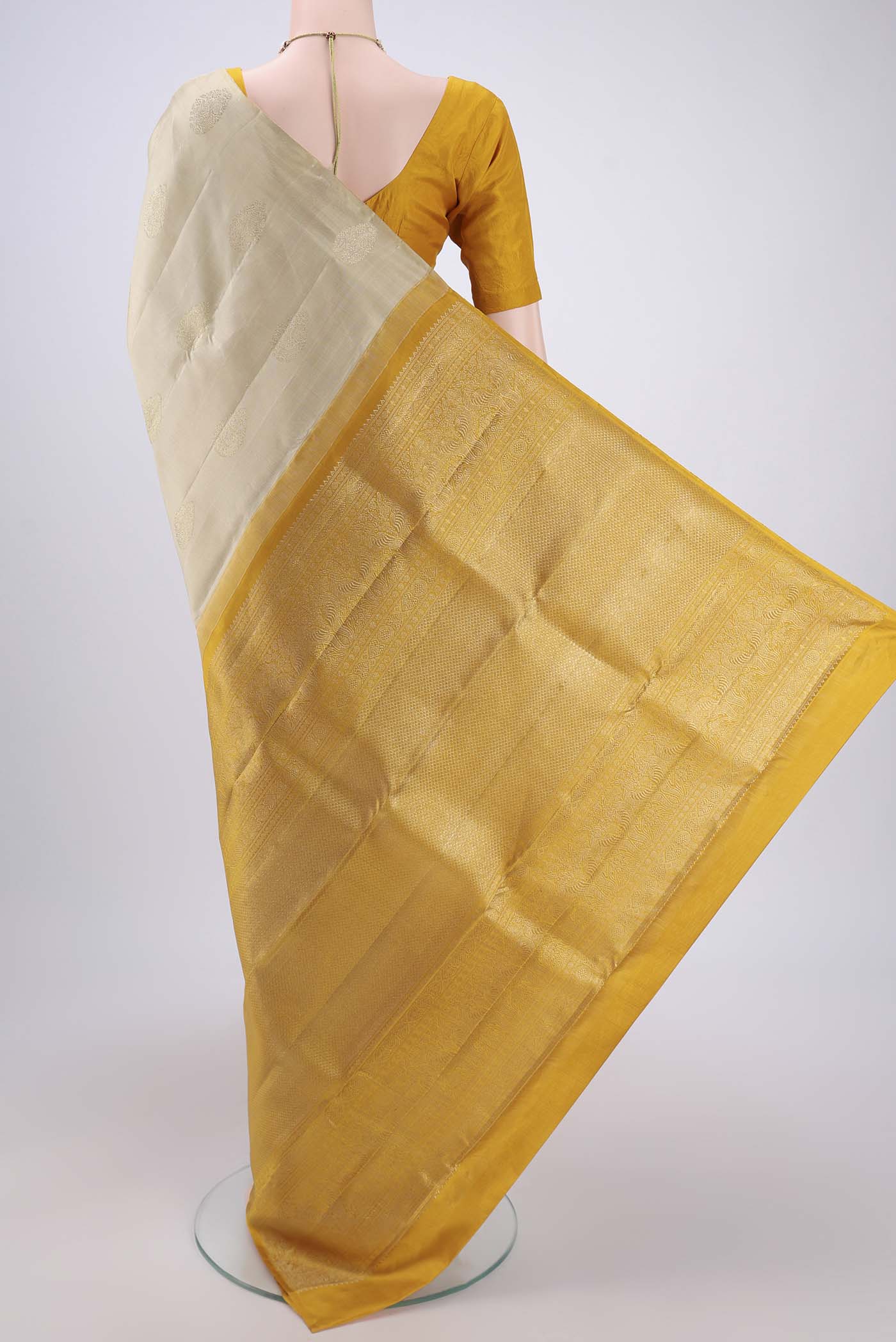 Flat view of Cream Dual Tone Kanchipuram Silk Saree with Plain Body and Plain Border. 