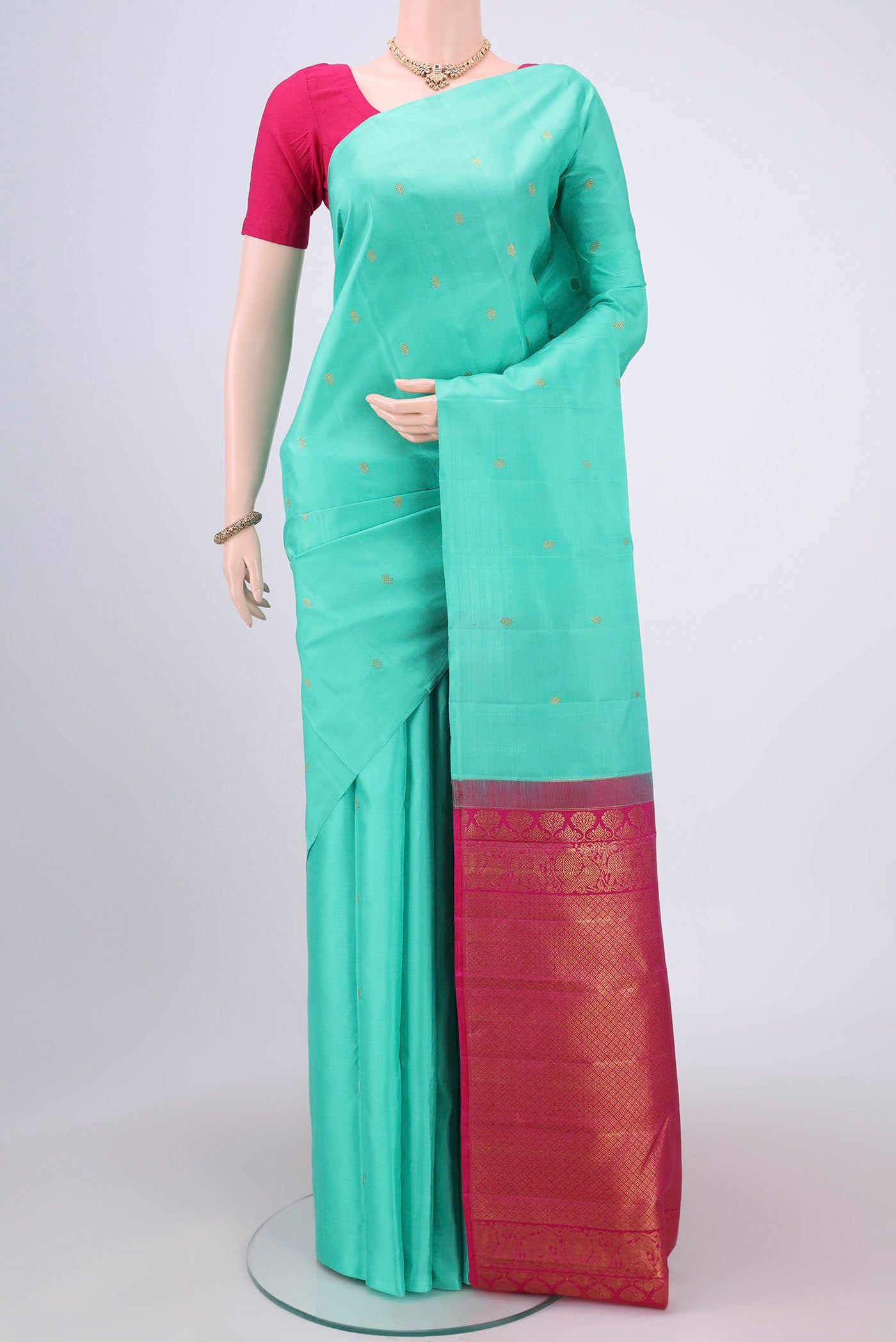 Sky Blue Dual Tone Kanchipuram Silk Saree with Zari Butta on the body and Attached Border.  displayed on a mannequin