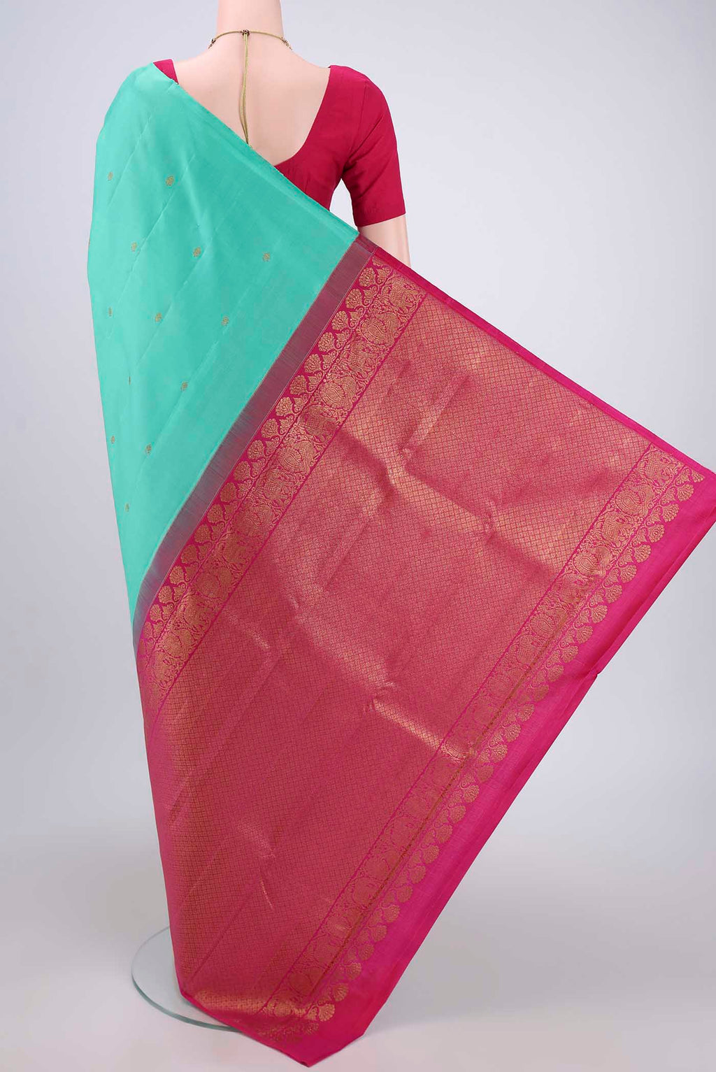 Flat view of Sky Blue Dual Tone Kanchipuram Silk Saree with Zari Butta on the body and Attached Border. 
