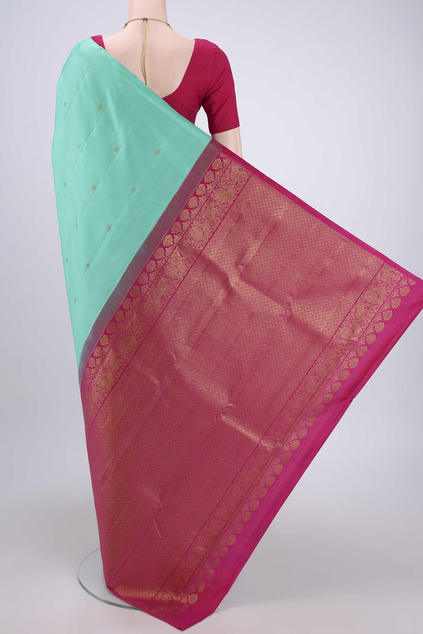 Flat view of Sky Blue Dual Tone Kanchipuram Silk Saree with Zari Butta on the body and Attached Border. 