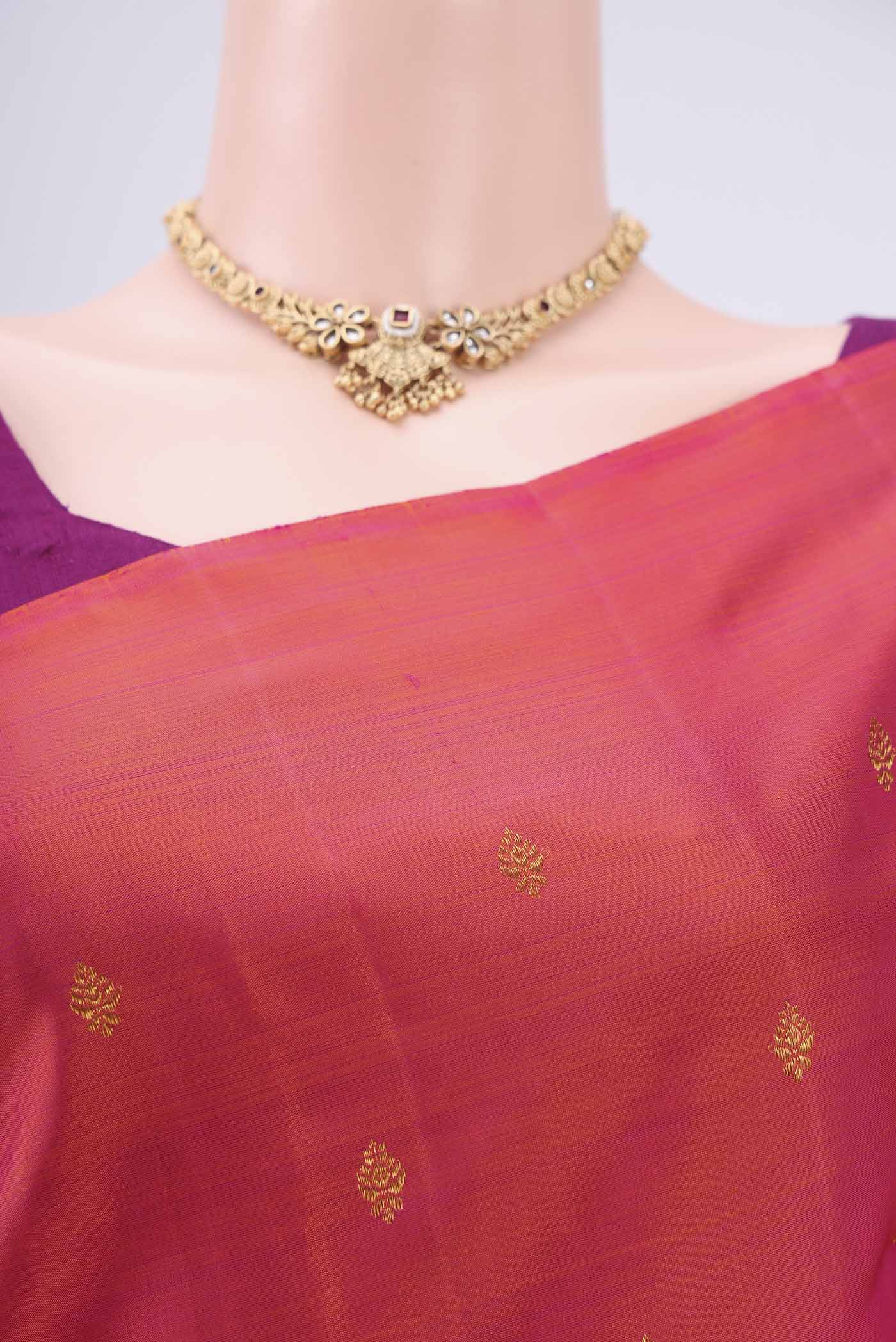 Border image of Orange Dual Tone Kanchipuram Silk Saree with Zari Butta on the body and Attached Border. 