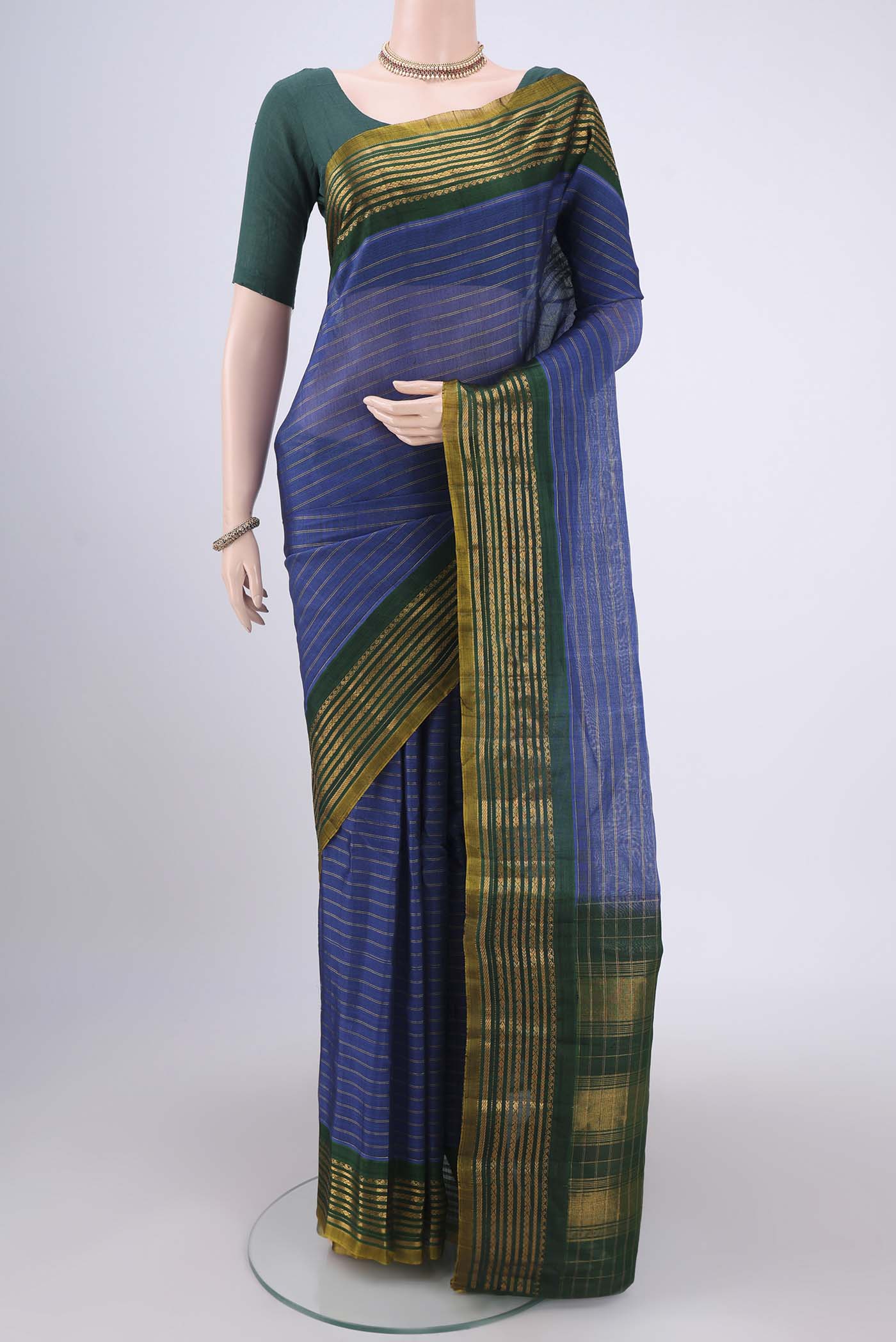 Blue Gadwal Silk Saree with Stripes on the body and Zari Border.  displayed on a mannequin