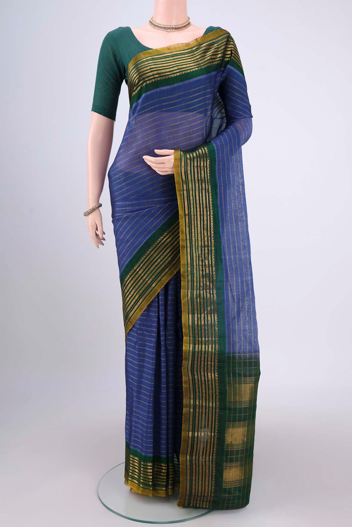 Blue Gadwal Silk Saree with Stripes on the body and Zari Border.  displayed on a mannequin