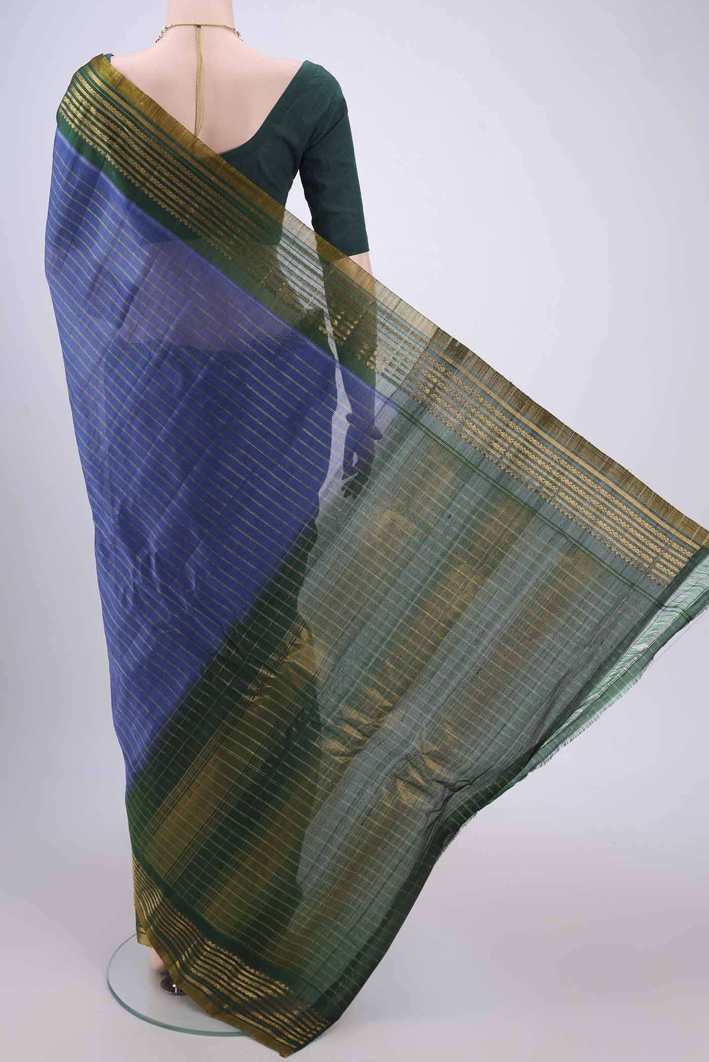 Flat view of Blue Gadwal Silk Saree with Stripes on the body and Zari Border. 