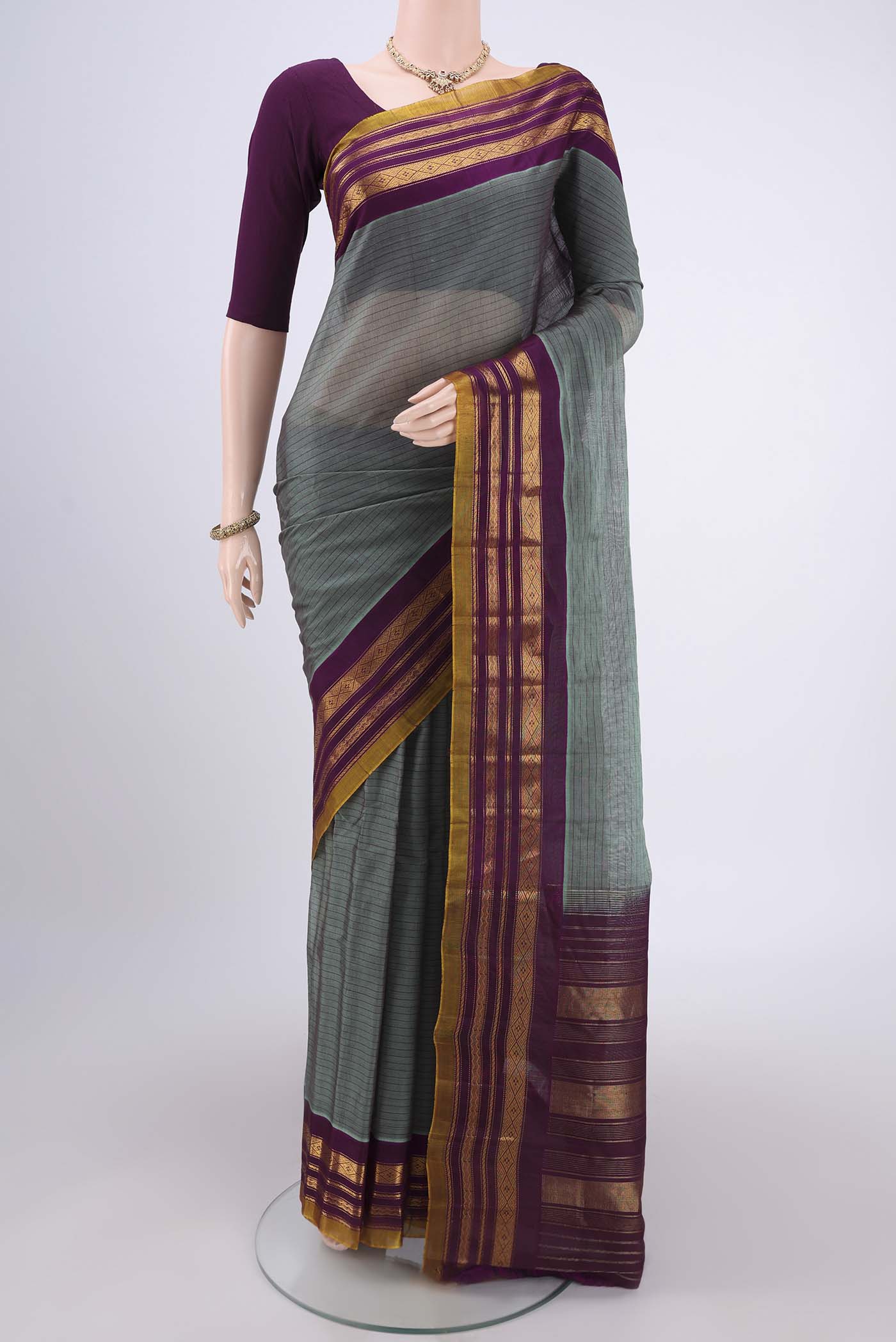 Davys Grey Gadwal Silk Saree with Stripes on the body and Zari Border.  displayed on a mannequin