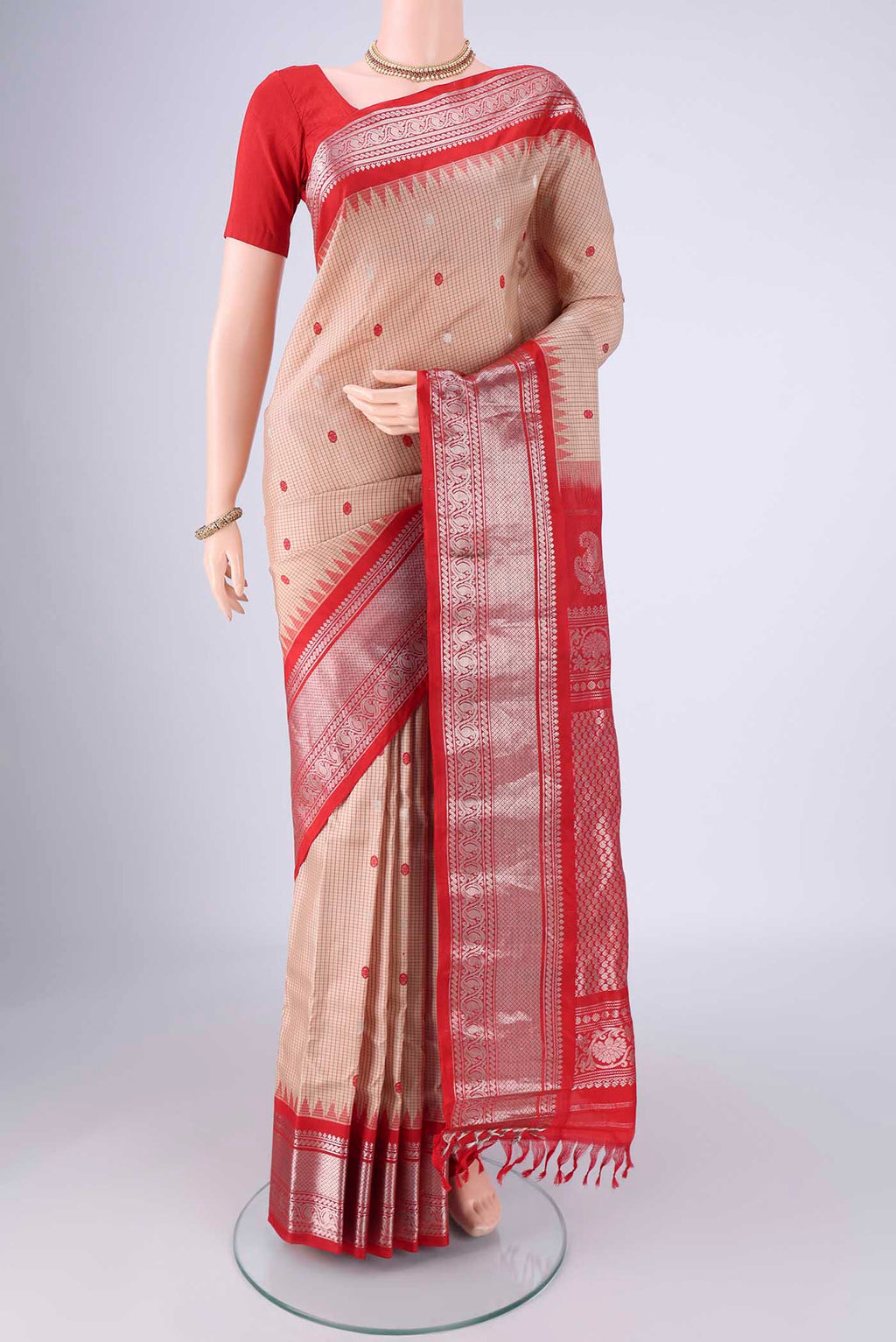 Beige Gadwal Silk Saree with Checked design on the body and Zari Border.  displayed on a mannequin