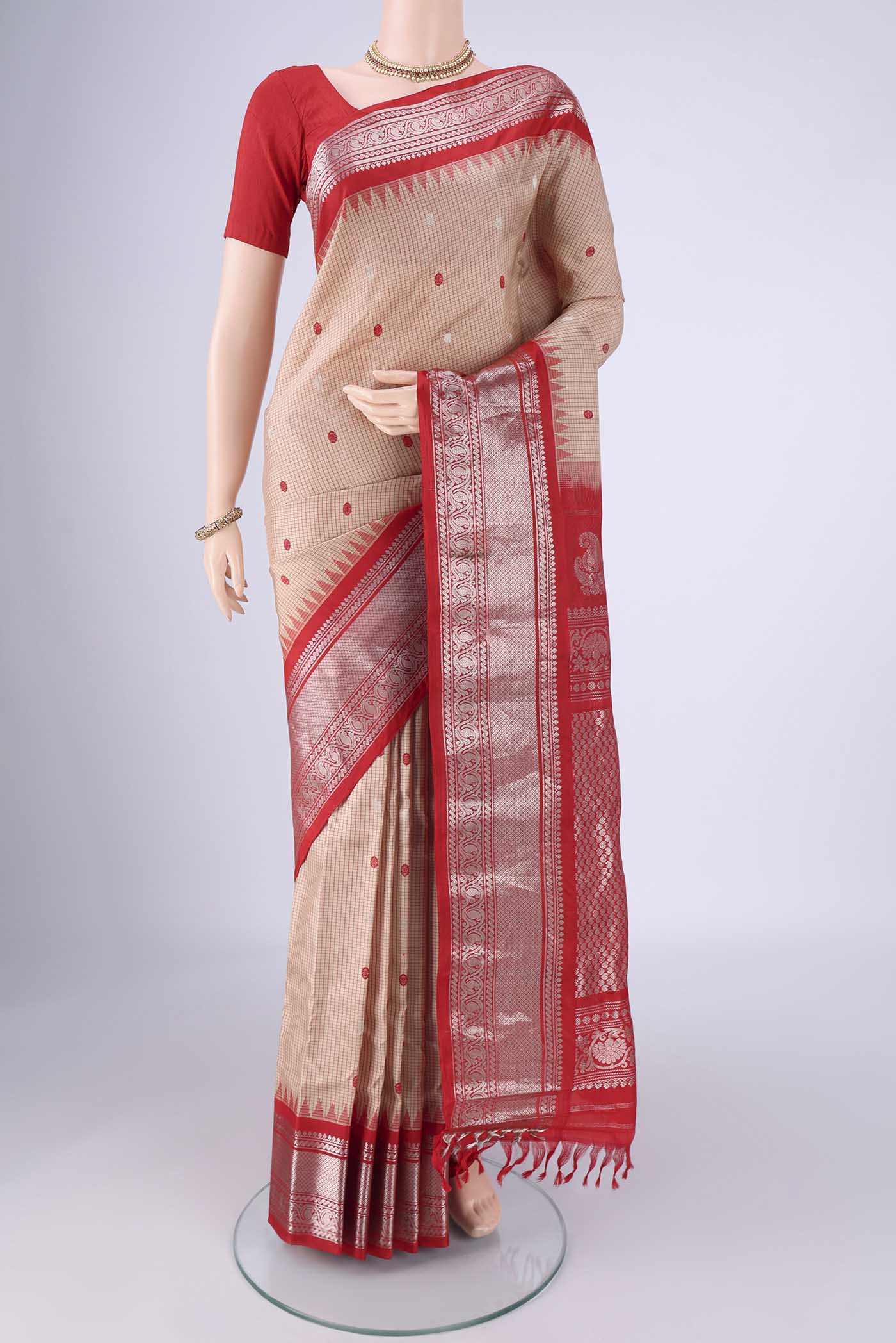Beige Gadwal Silk Saree with Checked design on the body and Zari Border.  displayed on a mannequin