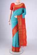 Turquoise Gadwal Silk Saree with Zari Butta on the body and Zari Border.  displayed on a mannequin