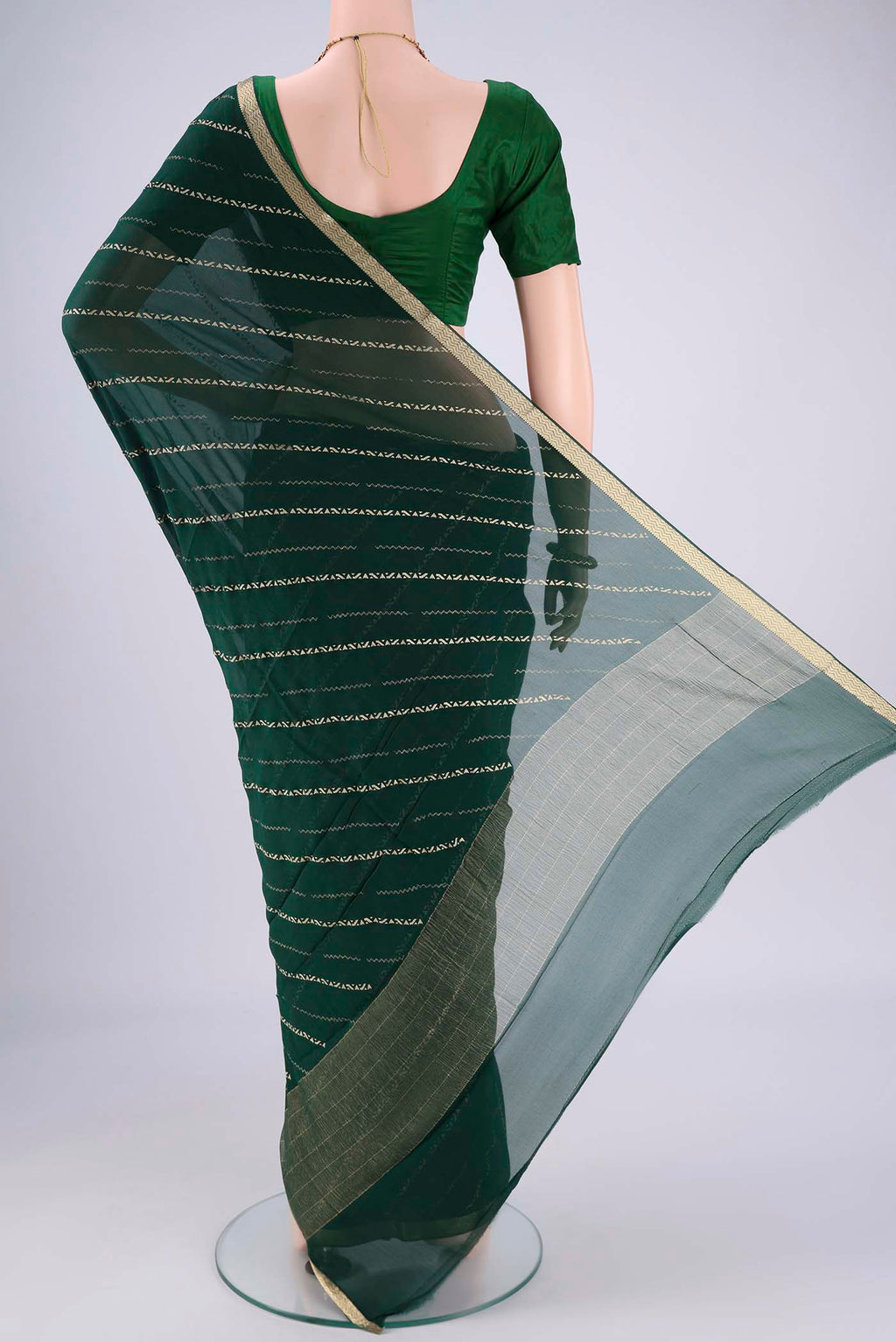 Flat view of Bottle Green Mysore Chiffon Saree with Stripes on the body and Zari Border. 